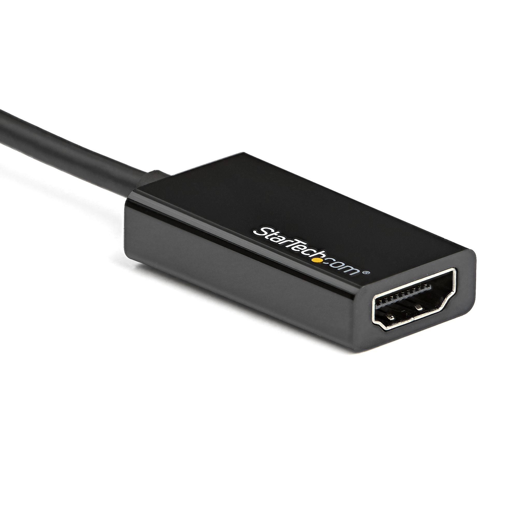 Un adaptador HDMI negro con cable. El adaptador tiene el logotipo de StarTech.com y un puerto HDMI.