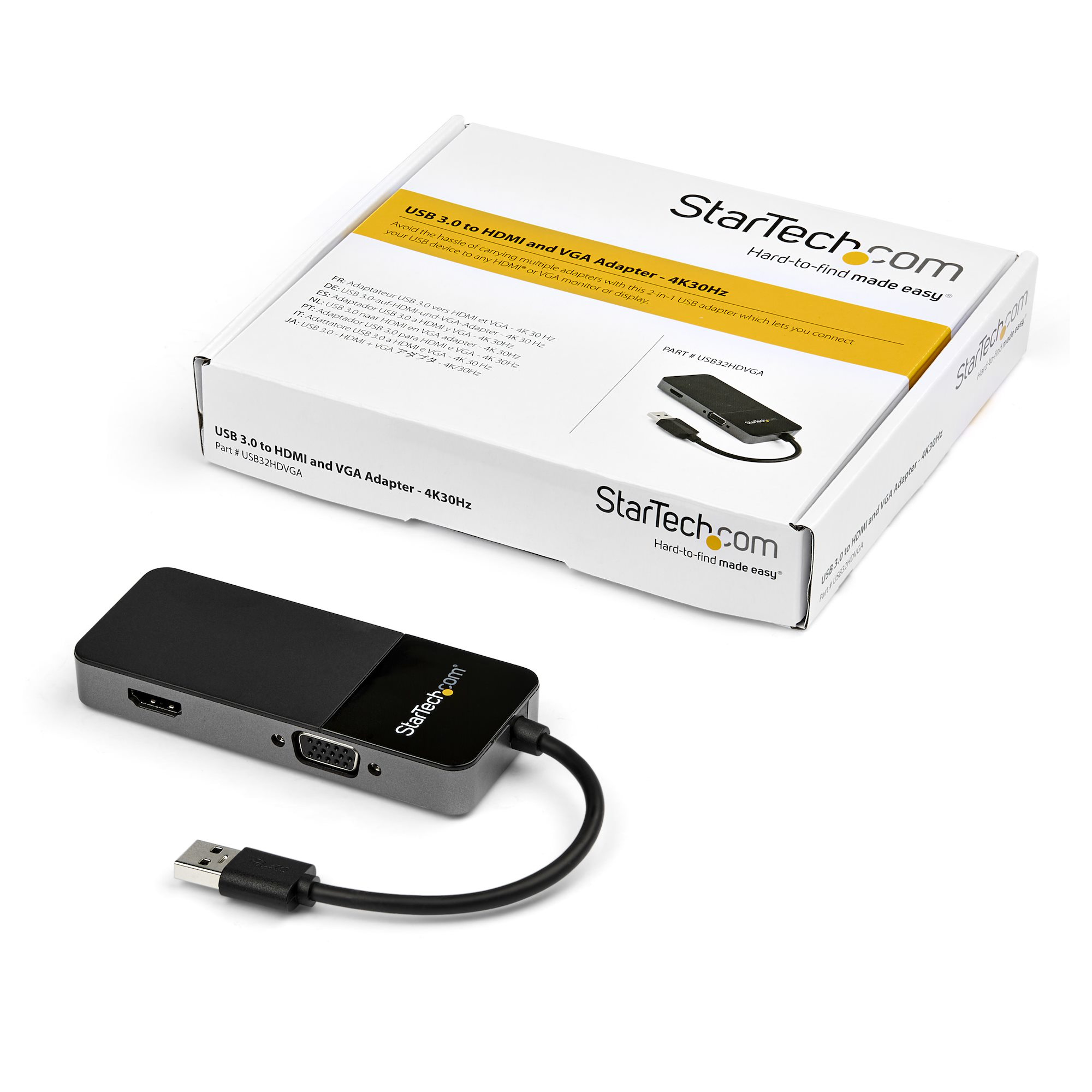 Un adaptador USB 3.0 a HDMI y VGA con cuerpo negro, conectado a un cable USB y el embalaje.