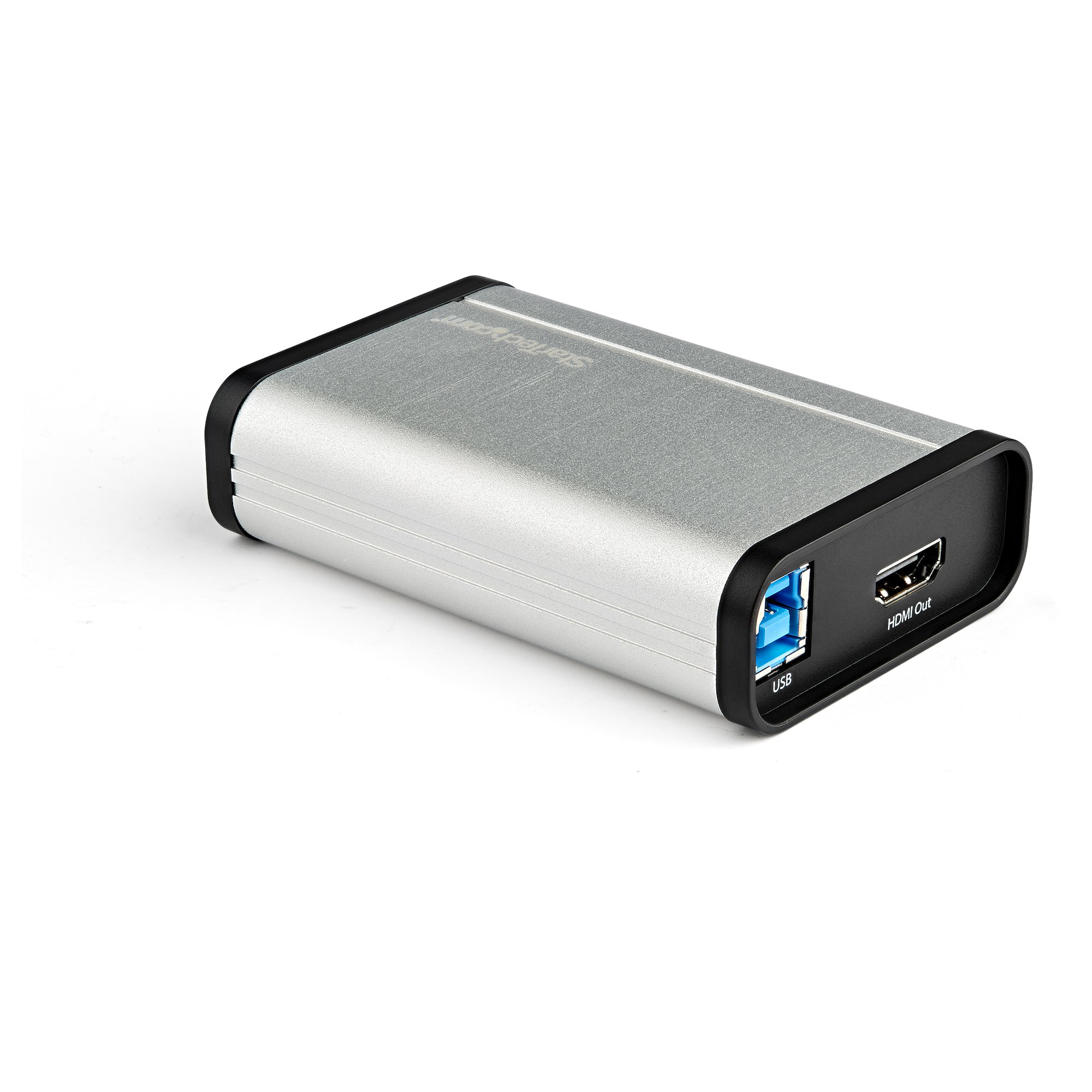 Un dispositivo rectangular plateado con bordes negros. Tiene puertos USB y HDMI. El fondo es blanco.