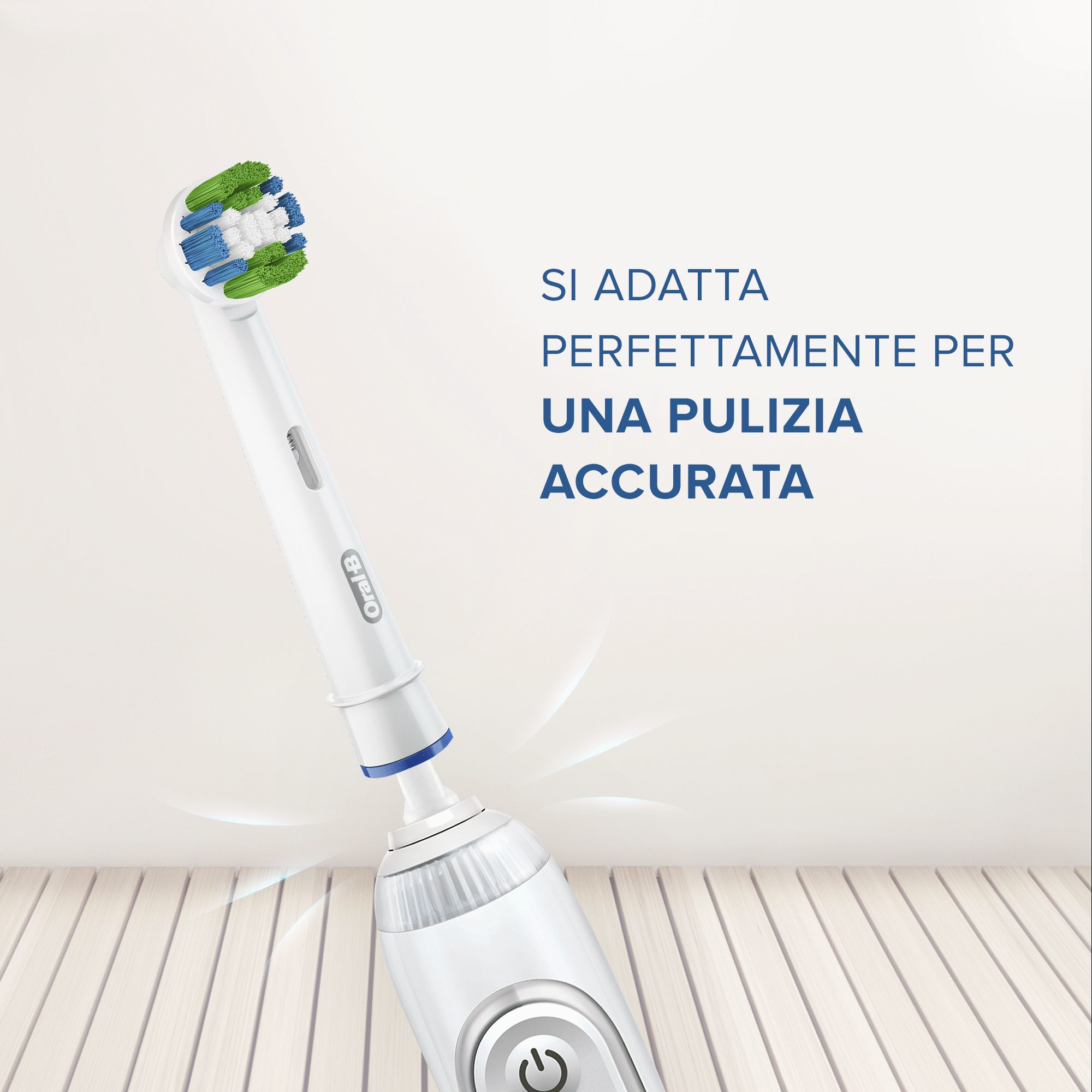 Se muestra un cepillo de dientes eléctrico con cerdas azules, verdes y blancas sobre un fondo blanco y de madera.