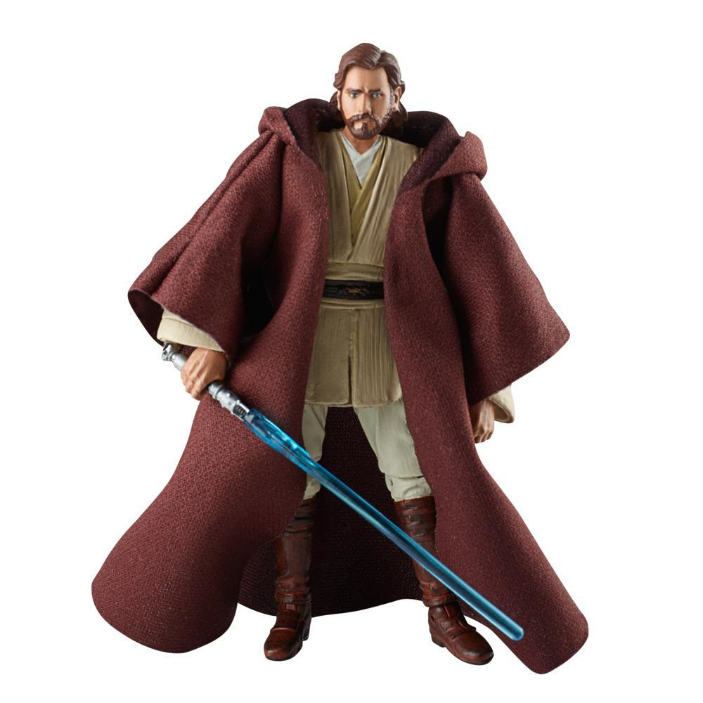 Una figura di Star Wars di Obi-Wan Kenobi con una spada laser blu, una veste marrone e stivali, su sfondo bianco.