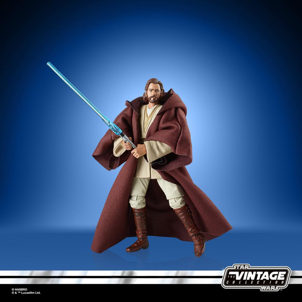 Action figure di Obi-Wan Kenobi, con una spada laser blu, in un mantello marrone. Logo Star Wars Vintage Collection in basso.