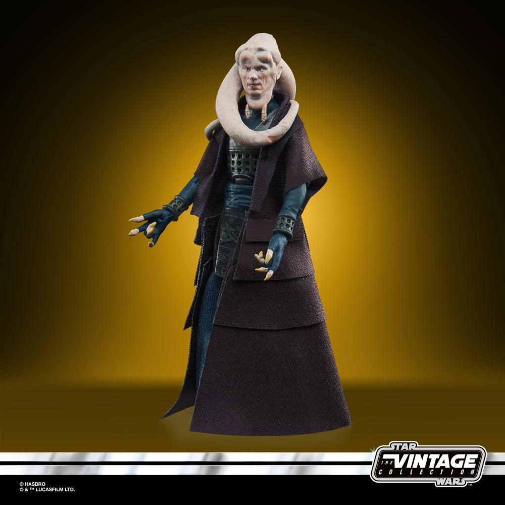 Una figura di Star Wars. Un alieno dalla pelle chiara con code bianche sulla testa indossa abiti scuri. È una figura da collezione vintage.