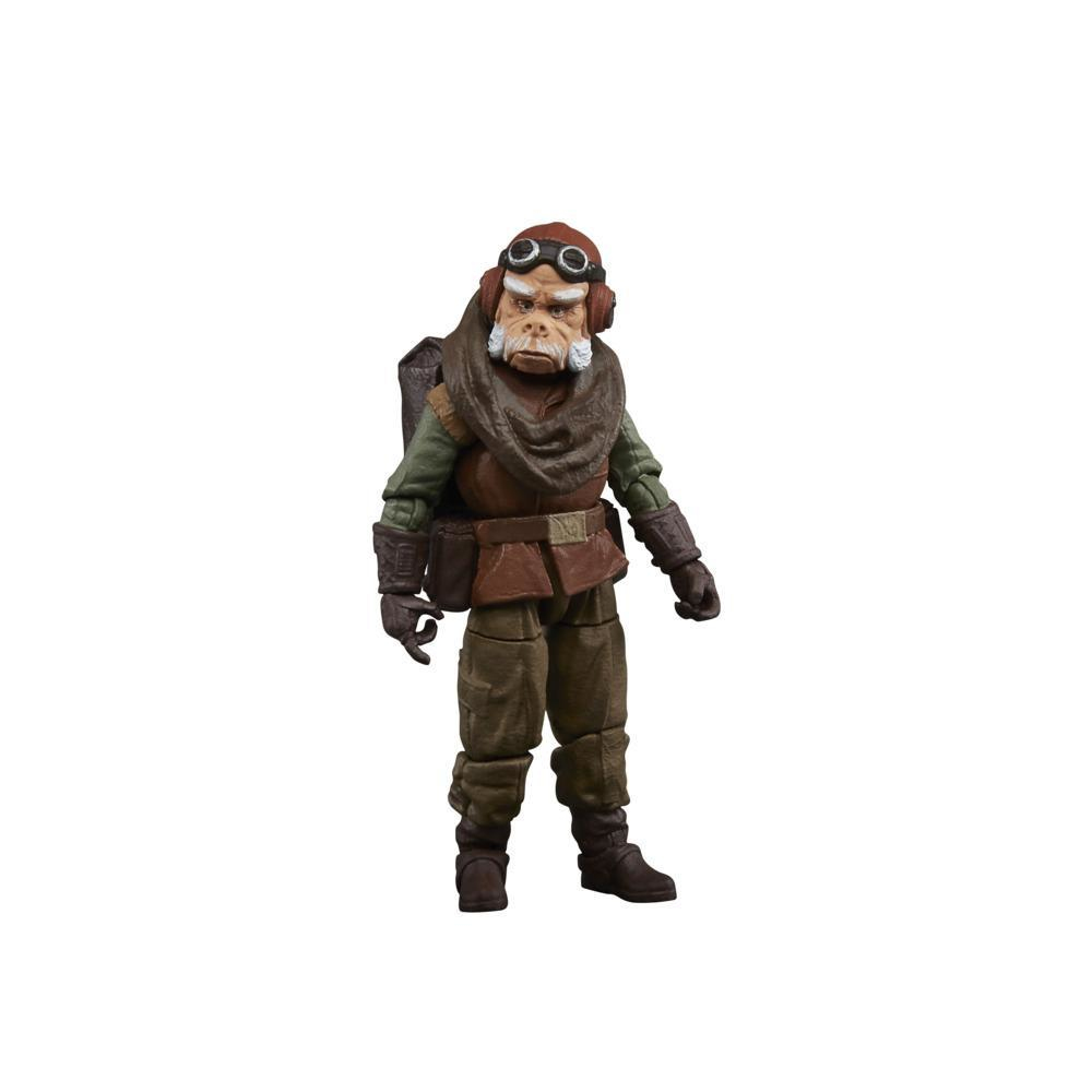 Una figura di Star Wars. È una creatura umanoide con occhiali, sciarpa e zaino. Indossa abiti marroni e verdi.