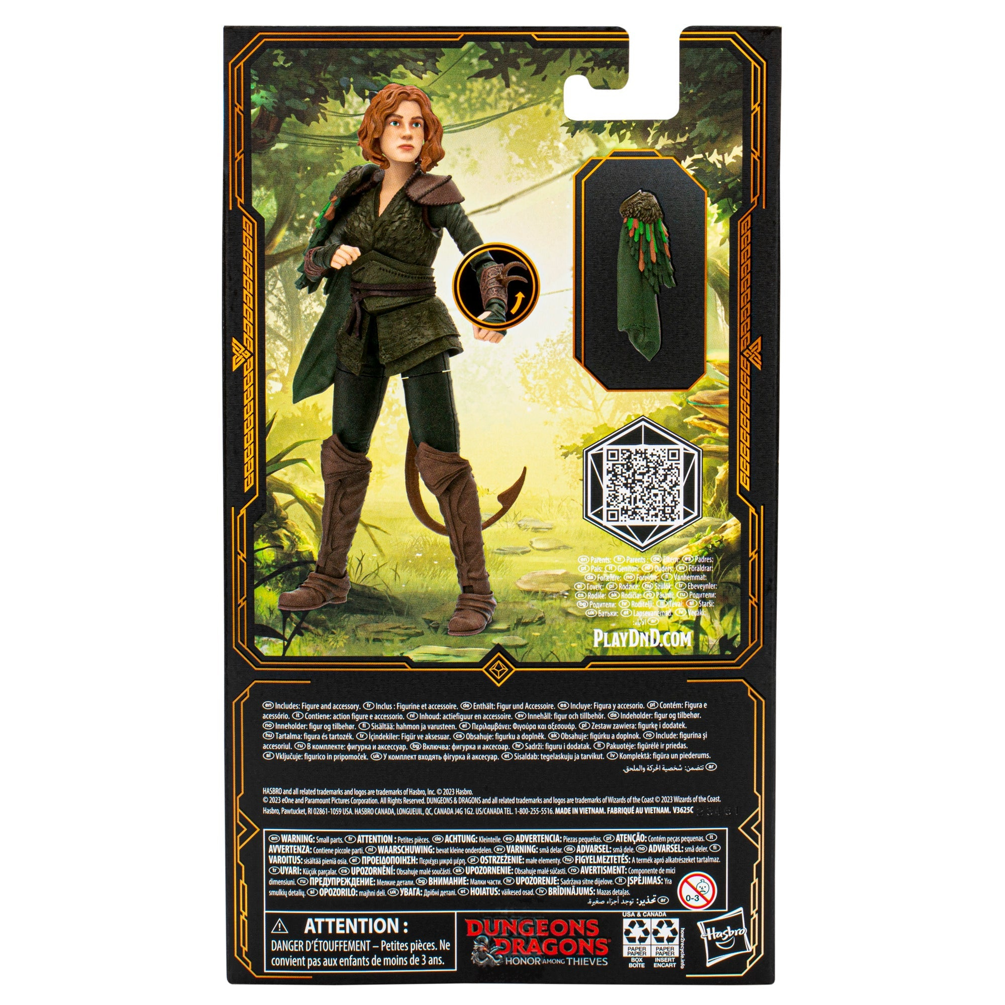Figur einer Frau in grüner Rüstung. Mit Umhang und Stab. Rückseite einer Produktverpackung.