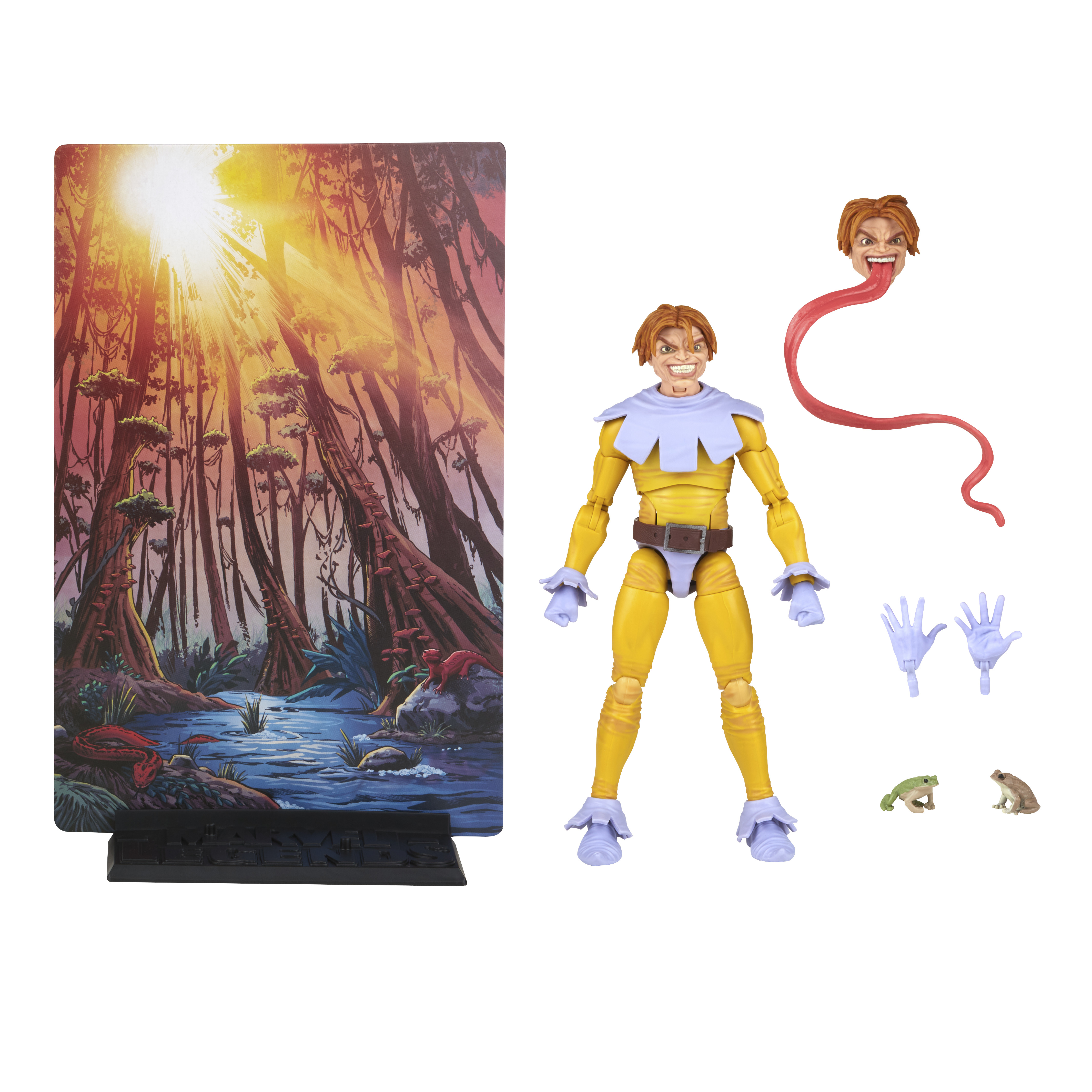 Action figure con sfondo di scena di palude. Figura in giallo e blu, due mani, una testa con lunga lingua e due piccole rane.