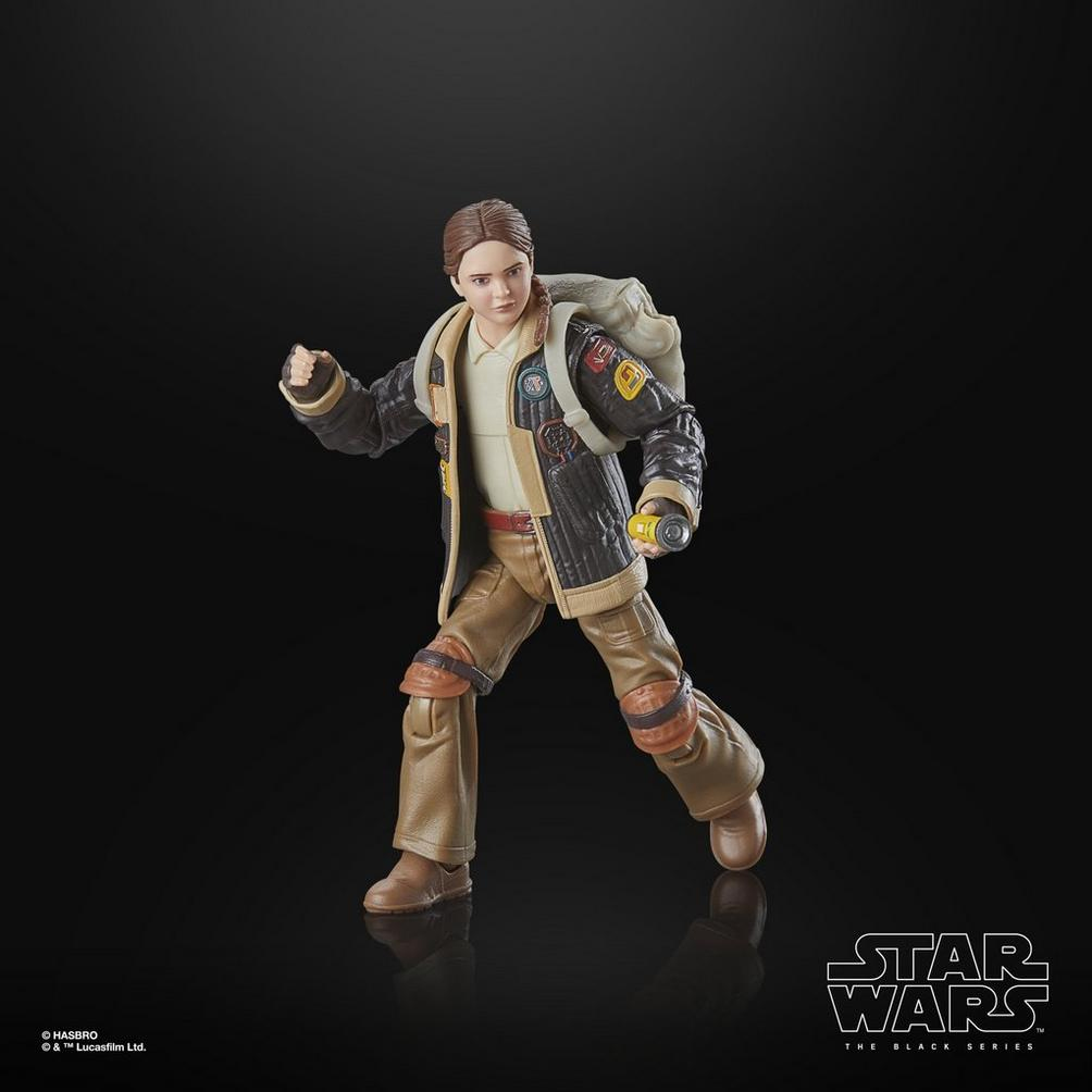 Bir Star Wars aksiyon figürü. Figür, kahverengi pantolon, beyaz gömlek, siyah ceket ve sırt çantası takan bir kadın.