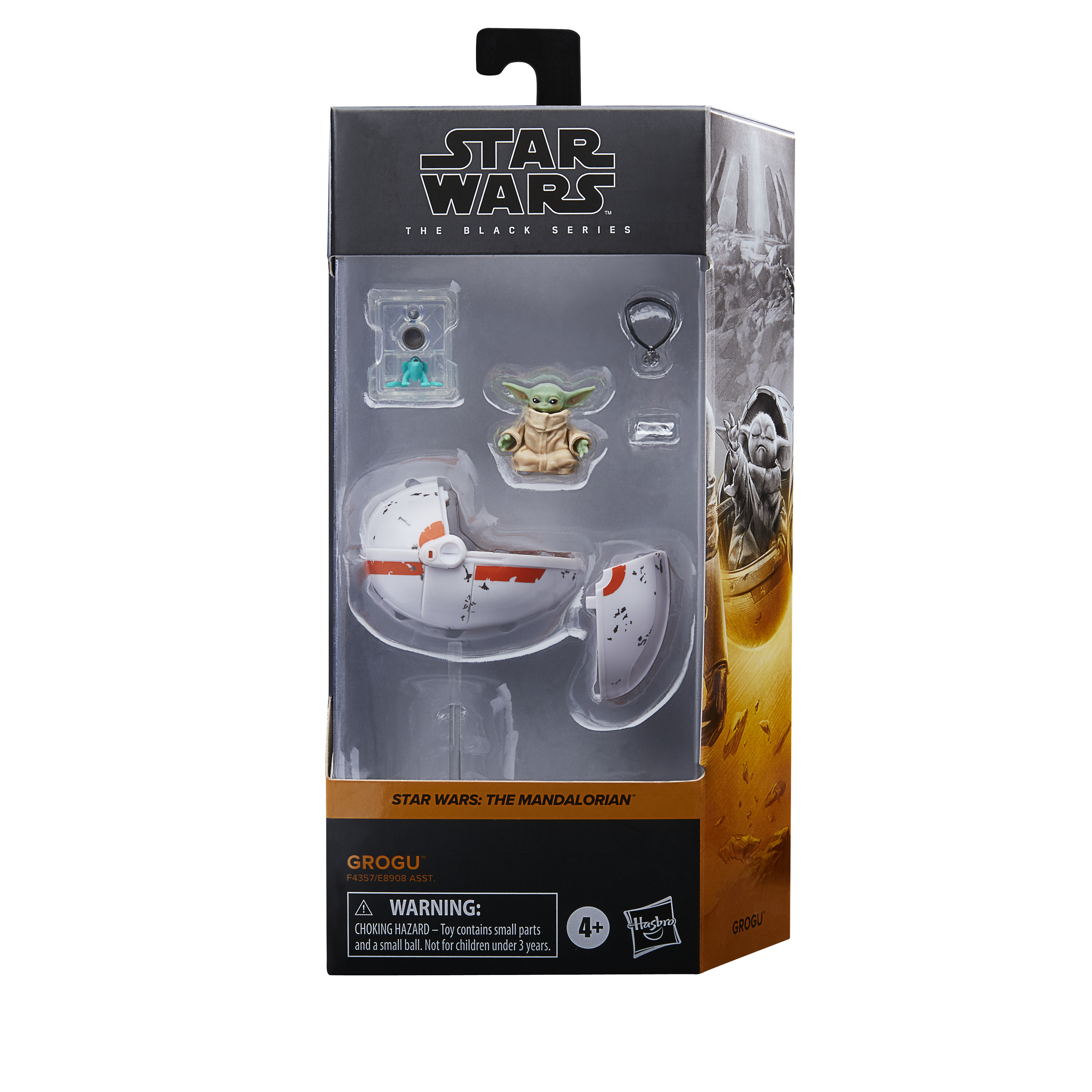 Una action figure di Grogu di Star Wars in una scatola. Include Grogu, una capsula, una rana e accessori.