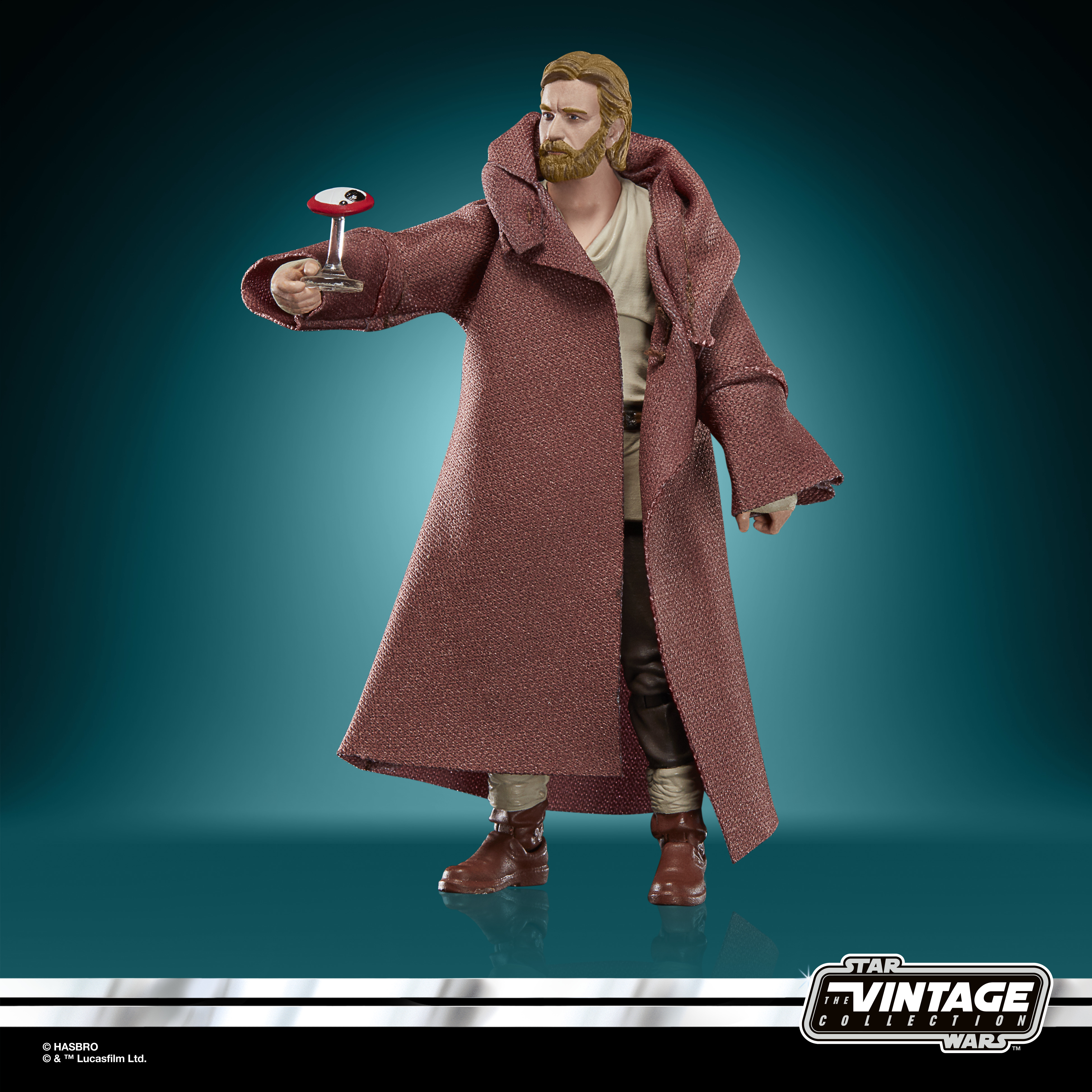 Figura de Obi-Wan Kenobi con túnicas marrones, sosteniendo un objeto rojo y blanco. Logotipo de Star Wars Vintage Collection en la esquina.