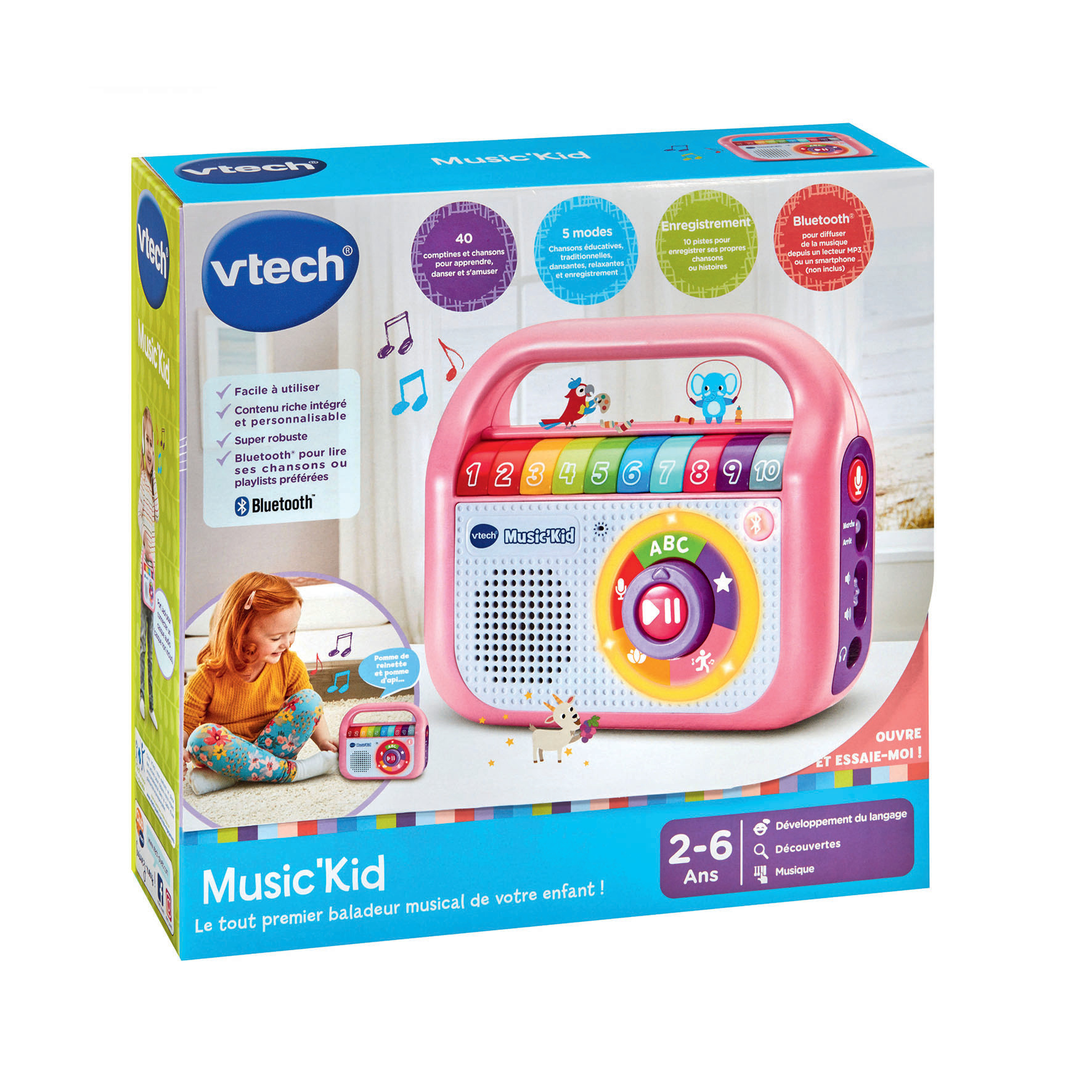 Rosa VTech Music'Kid Spielzeugbox. Ein Mädchen wird mit einem ähnlichen Spielzeug gezeigt. Es hat Knöpfe und Zahlen.