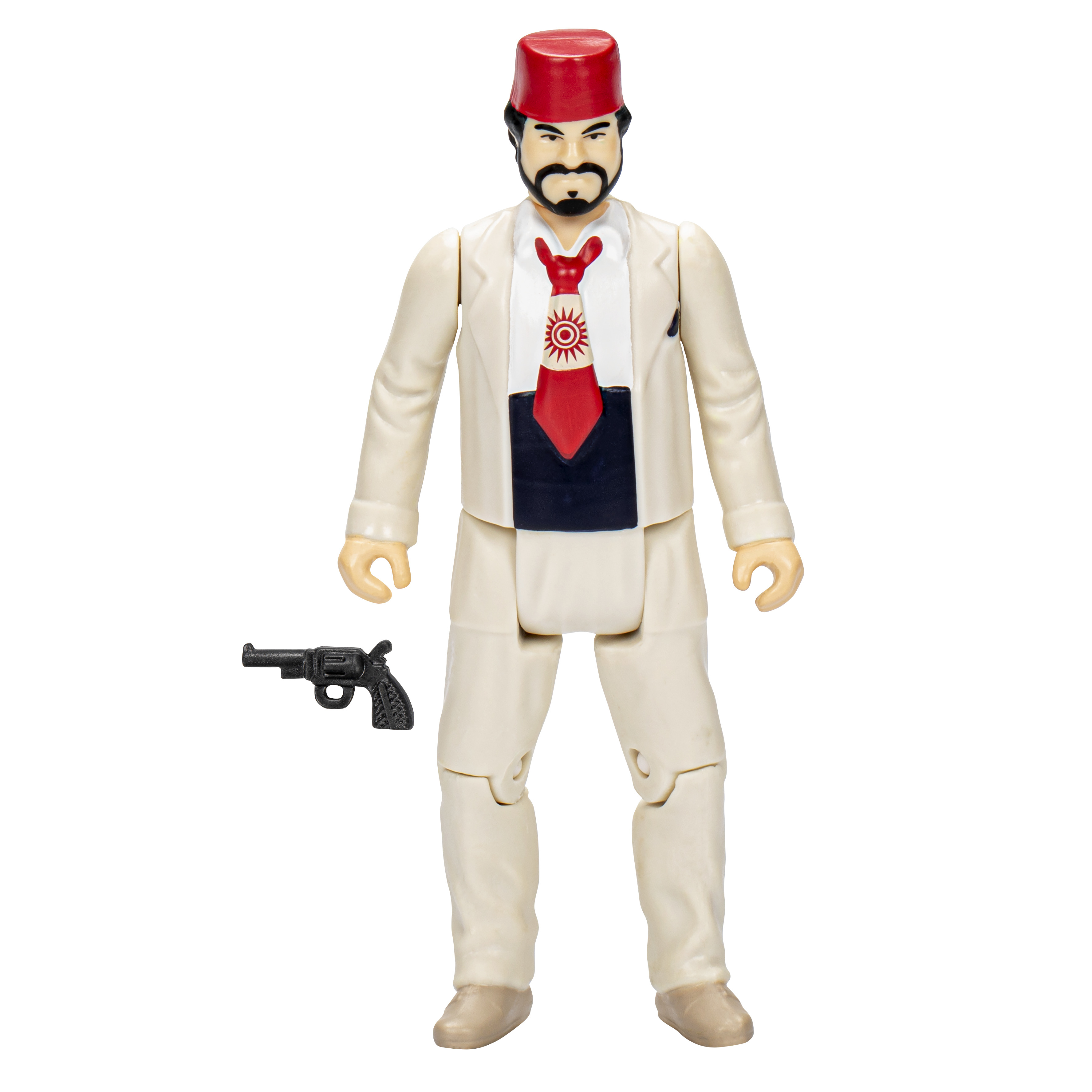 Una statuetta con abito color crema e fez rosso tiene una pistola. È visibile una cravatta rossa con un disegno del sole.