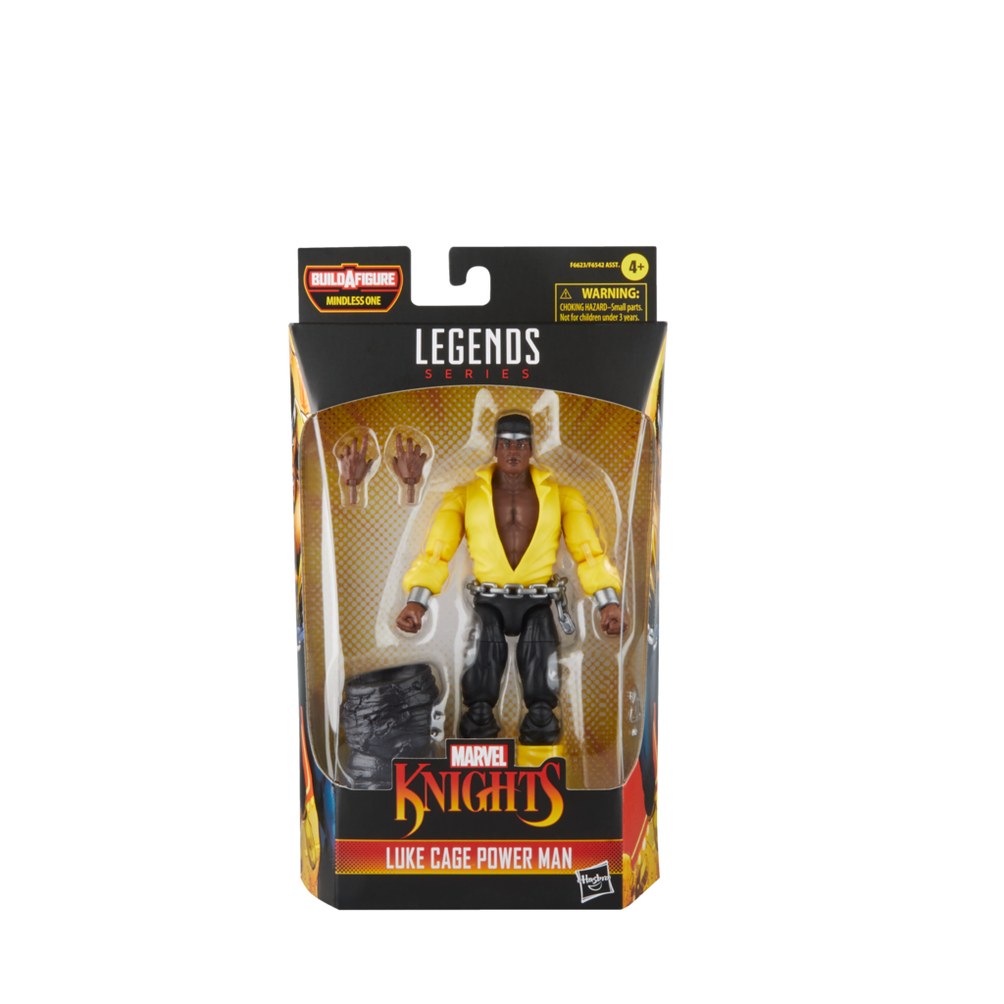 Figurka Luke'a Cage'a w żółtej koszuli i czarnych spodniach jest prezentowana w pudełku Marvel Legends. Pudełko zawiera ostrzeżenia.