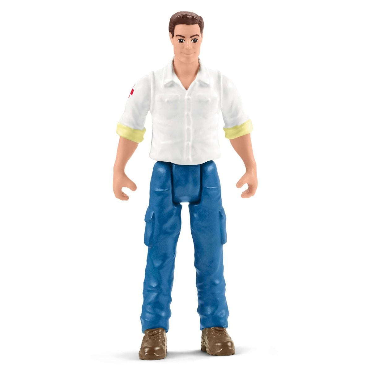 Una statuetta di un uomo con camicia bianca, pantaloni blu e stivali marroni. Ha i capelli castani corti e un'espressione amichevole.