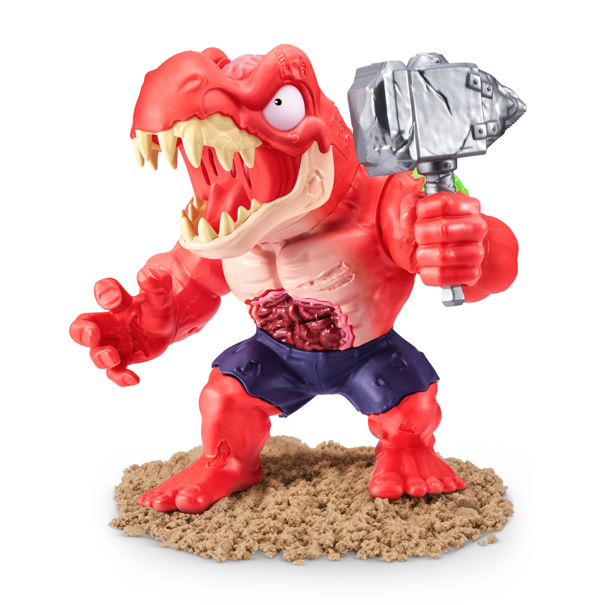 Czerwona zabawka dinozaura z młotkiem, na piasku. Ma odsłonięte wnętrzności i nosi szorty.