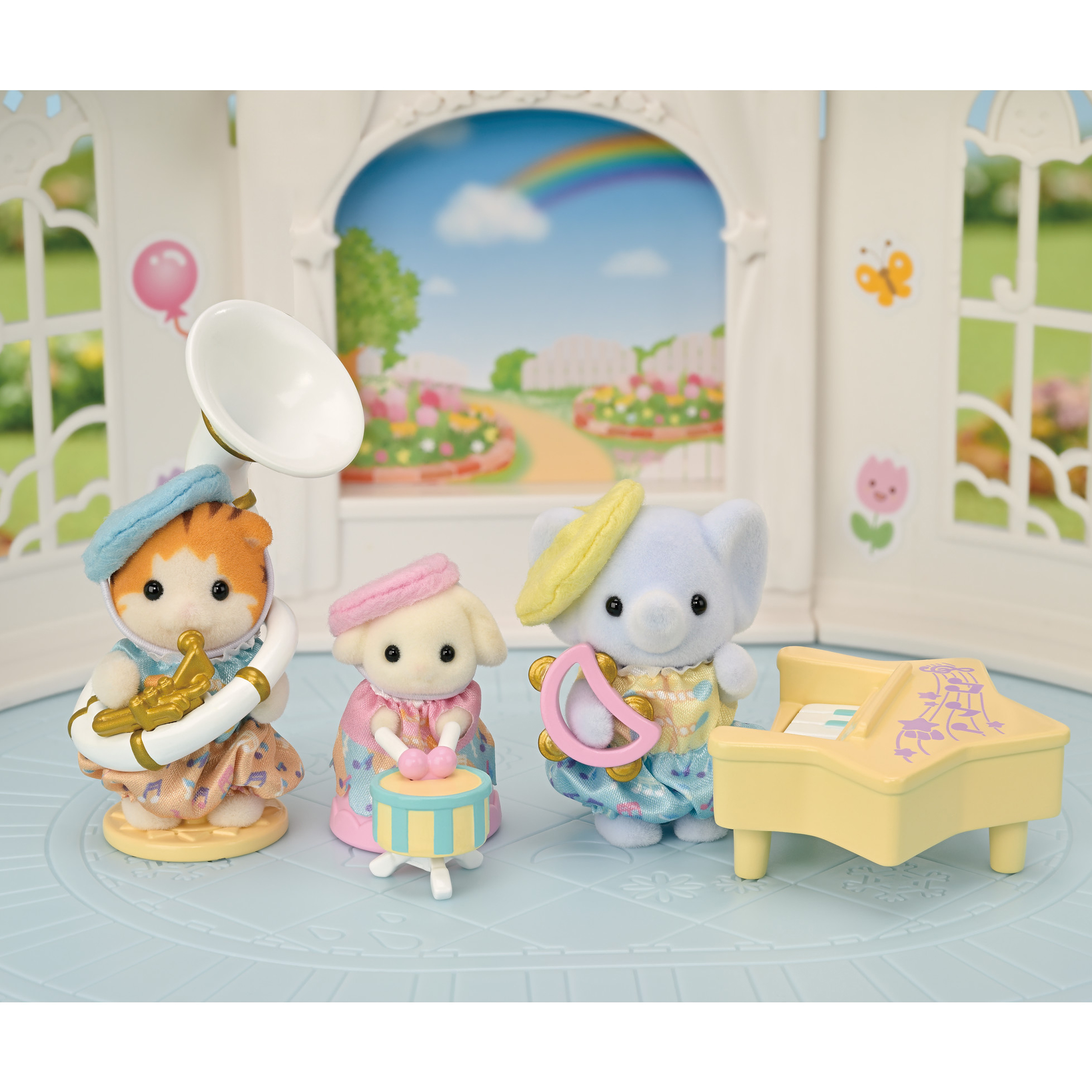Tres figuras de animales tocando instrumentos en una habitación, con un fondo de arcoíris.