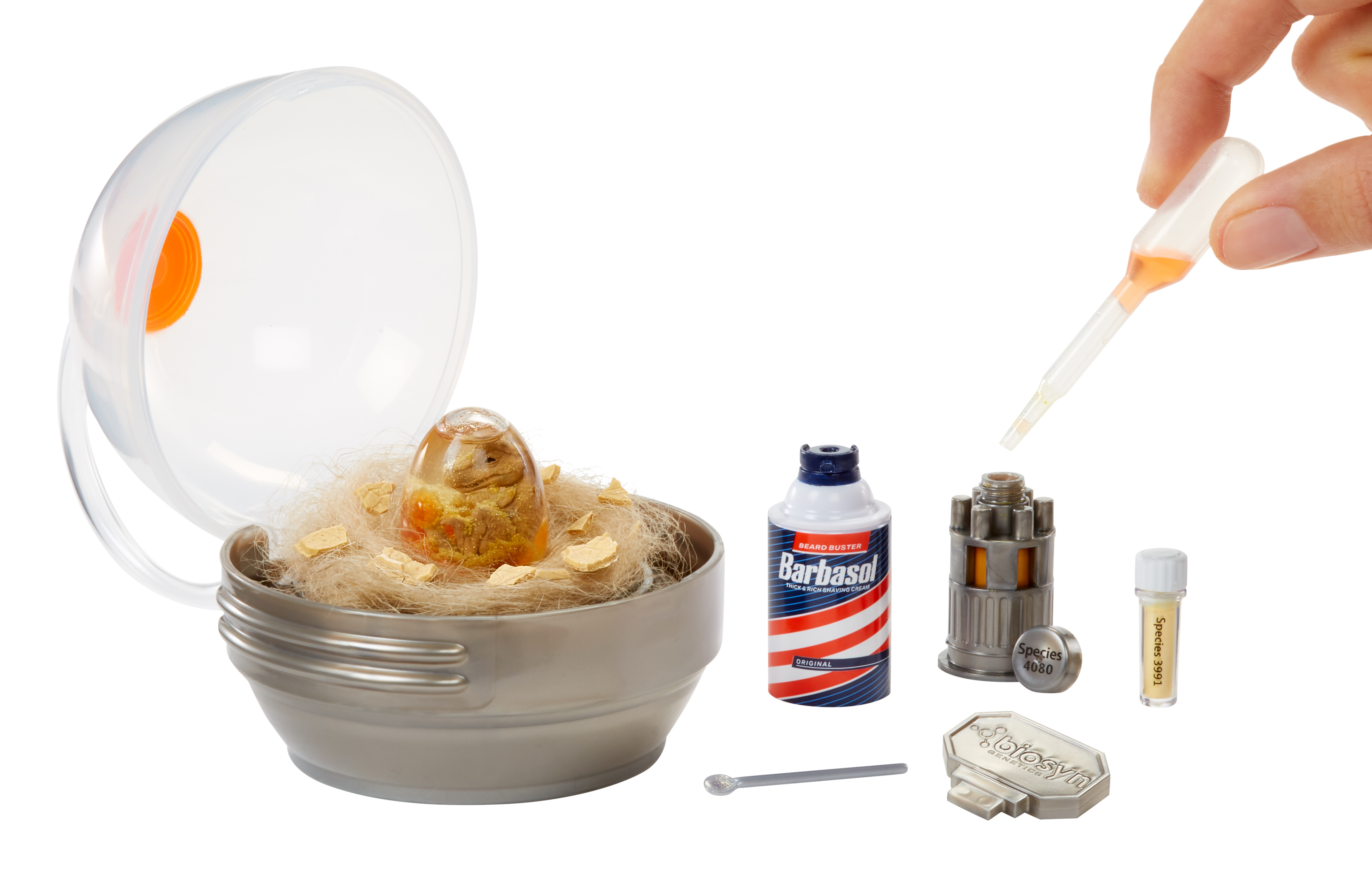 Zestaw z pojemnikiem w kształcie jaja, puszką Barbasol, metalowym urządzeniem i dłonią używającą zakraplacza.