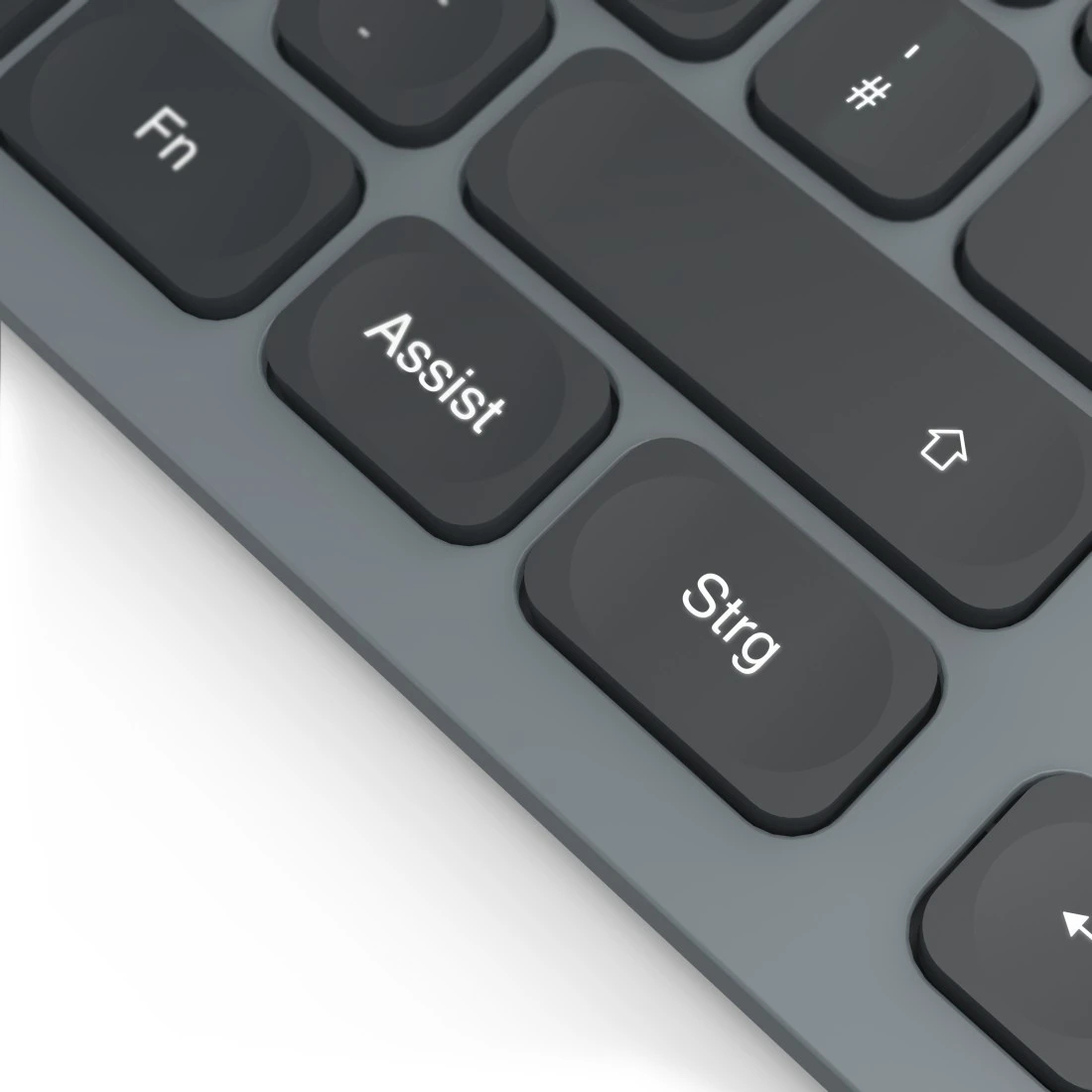 Zbliżenie klawiatury. Widoczne są szare klawisze z białymi napisami. Klawisze to Assist, Strg, Fn i symbol strzałki.