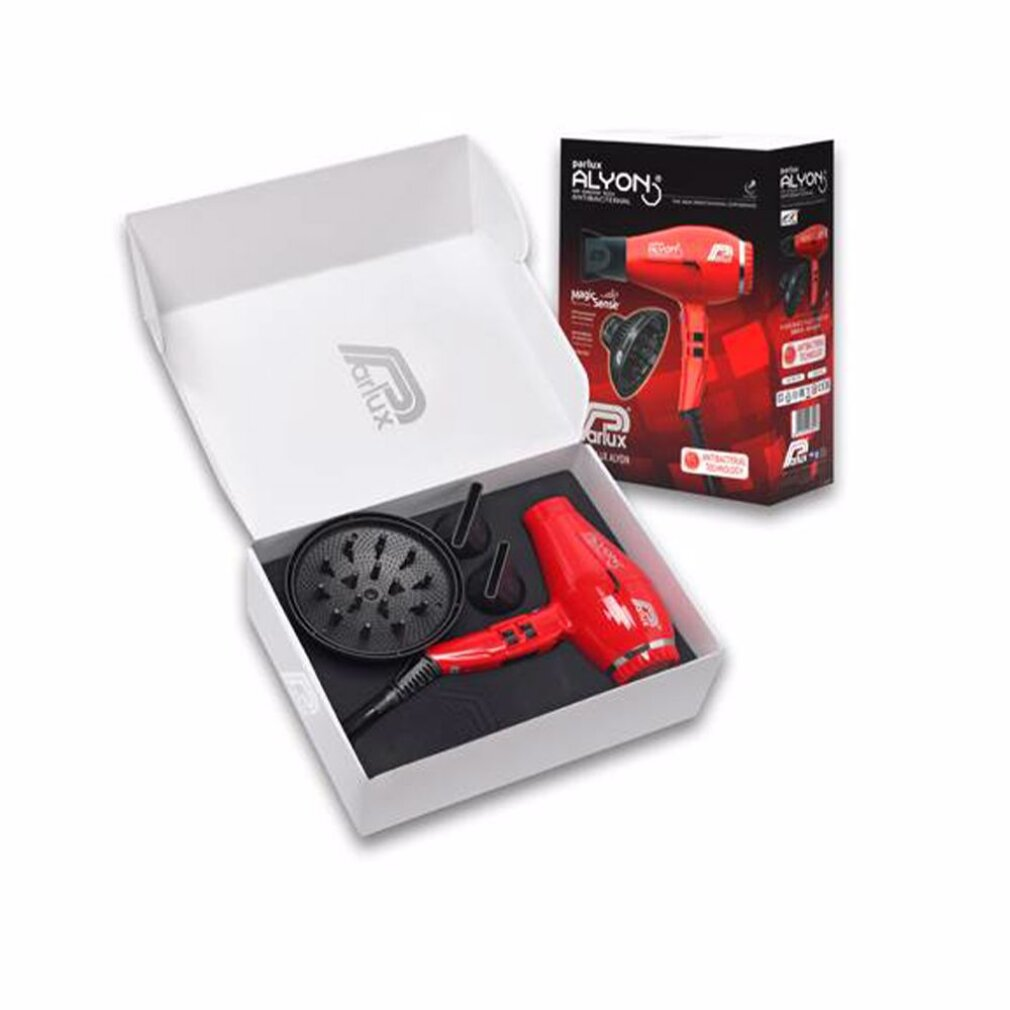 Un asciugacapelli rosso, un diffusore e accessori sono in una scatola bianca aperta, accanto a una scatola con lo stesso asciugacapelli.