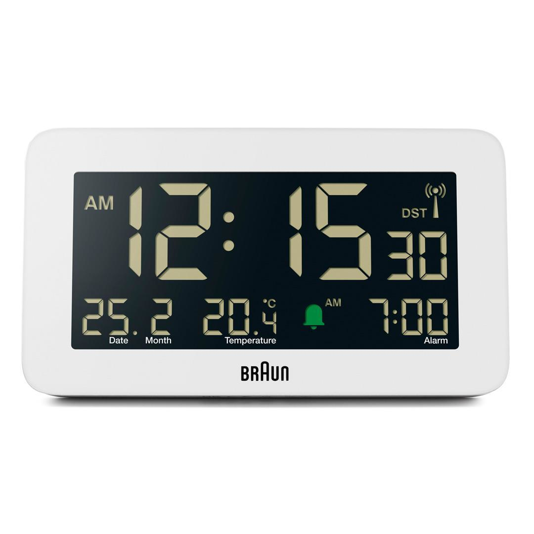 Weißer digitaler Braun-Wecker mit Anzeige 12:15:30 Uhr, 25.2 Datum, 20.4 Grad und Weckruf um 7:00 Uhr.