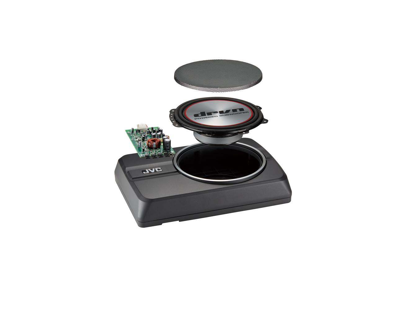 Un subwoofer JVC desmontado. Los componentes incluyen un altavoz, una placa de circuito y una caja negra. El altavoz tiene el texto 'drvn powered subwoofer'.