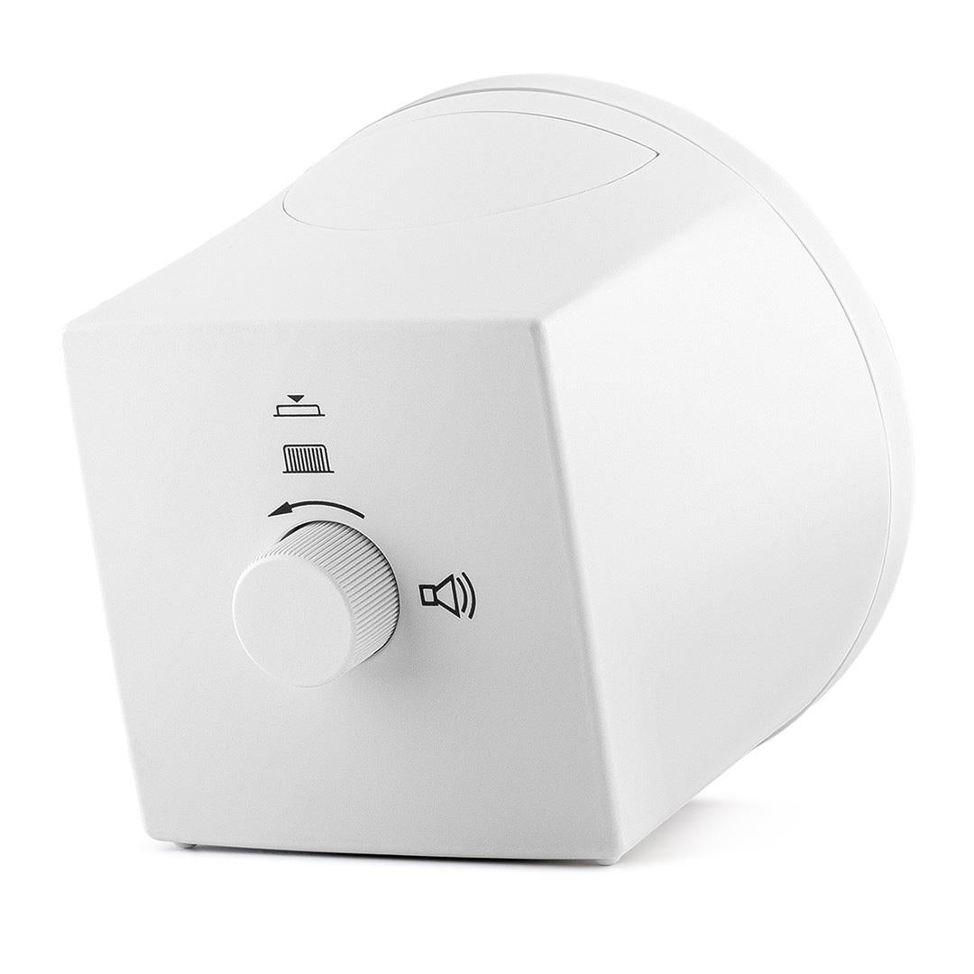 Un haut-parleur blanc avec un bouton de contrôle du volume et un symbole de haut-parleur. Il est incliné pour montrer son côté et le dessus.