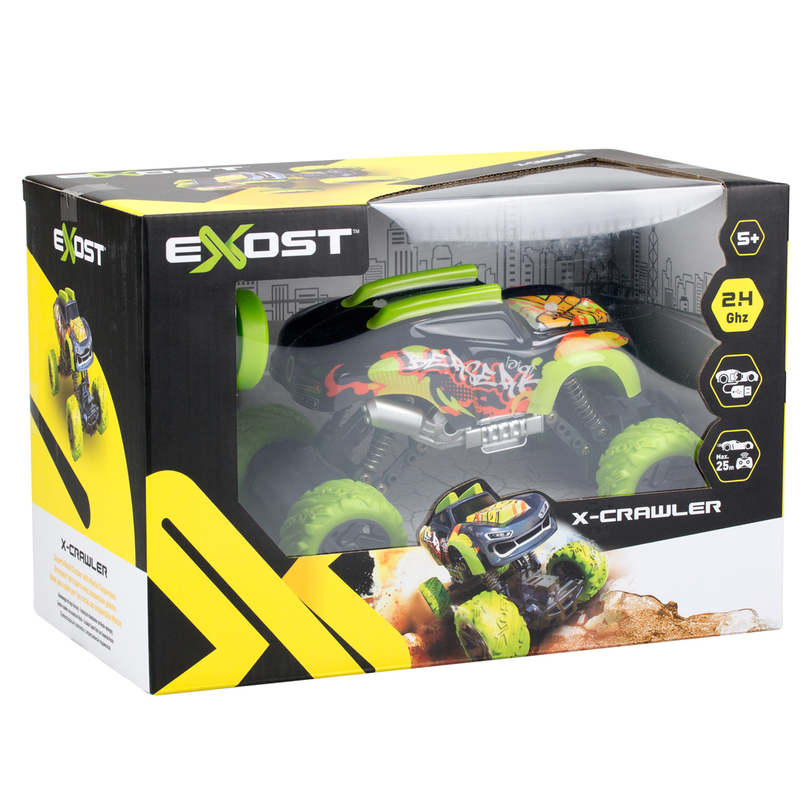 Un coche de juguete X-Crawler en su caja. El coche es negro, verde y naranja. La caja es negra, amarilla y transparente.