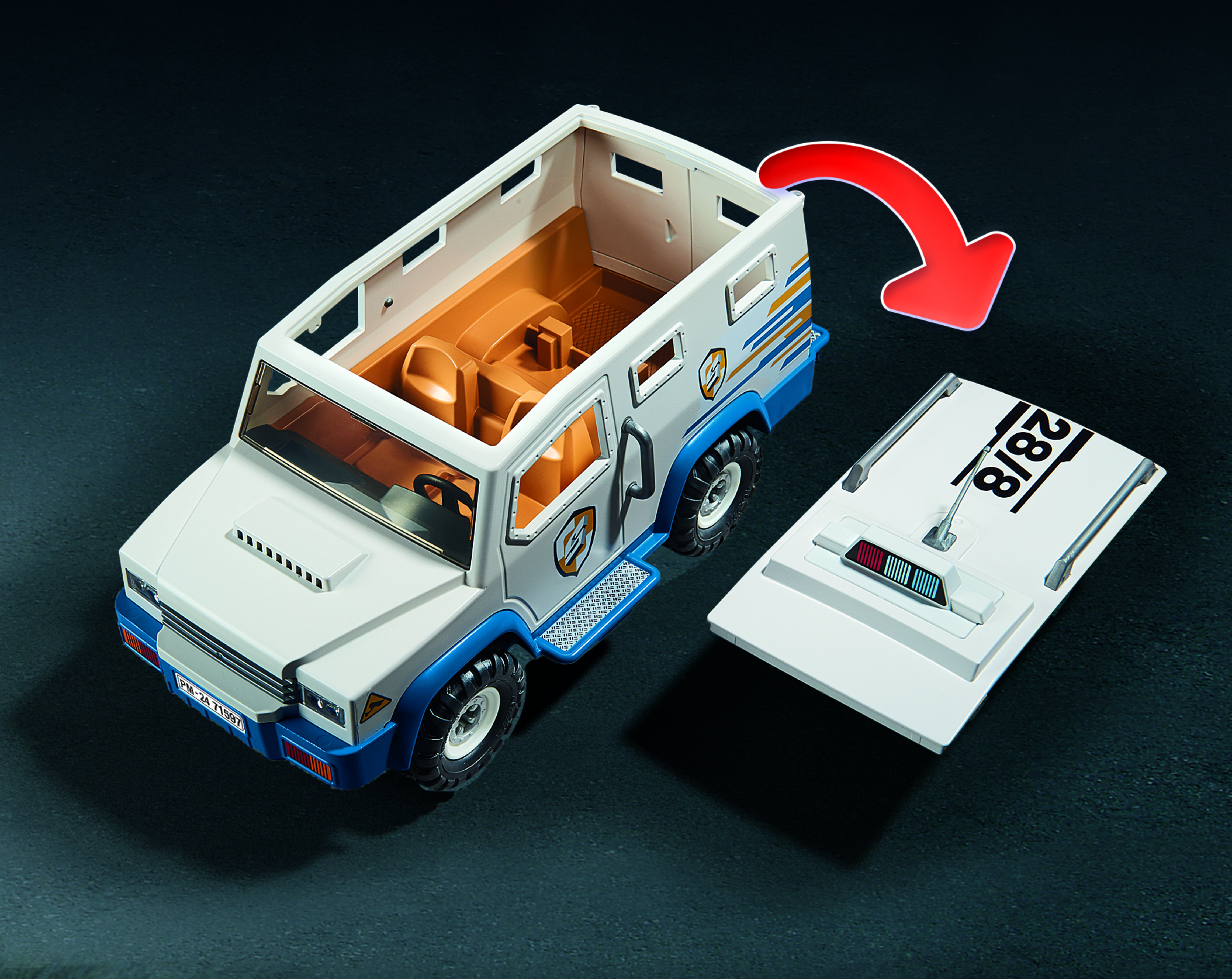 Un camion giocattolo bianco con dettagli blu e tetto aperto. Una freccia rossa indica il tetto rimosso.