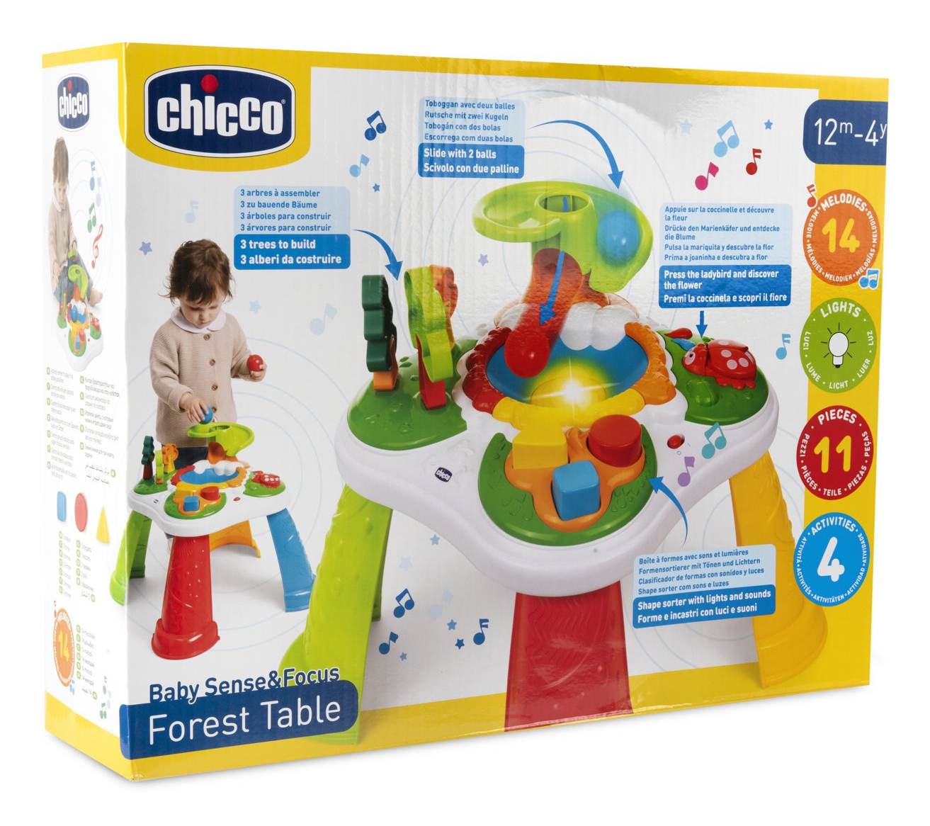 Pudełko z zabawkami przedstawia dziecko bawiące się kolorowym stołem w leśnym klimacie ze światłami i dźwiękami.