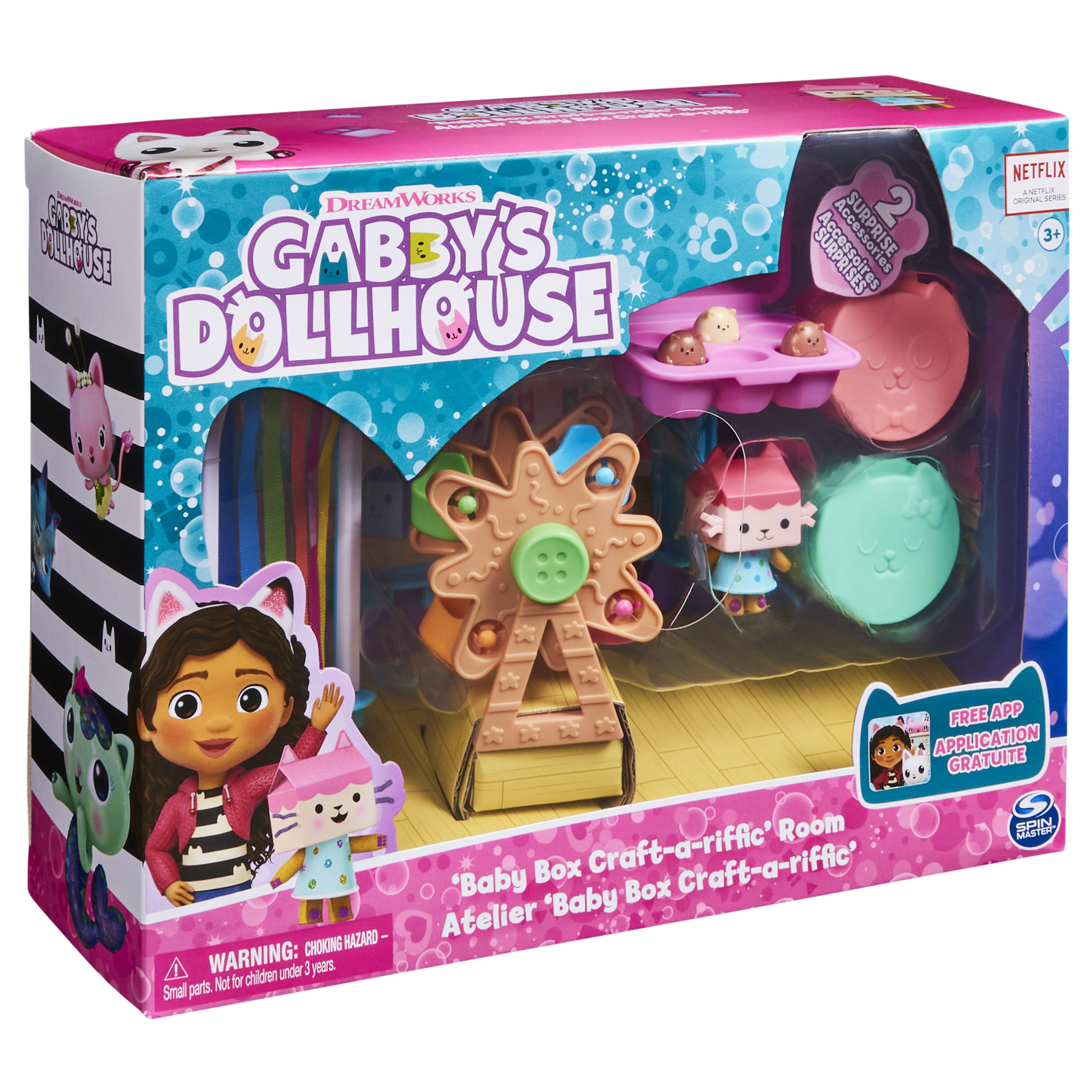 Eine Spielzeugkiste von 'Gabby's Dollhouse'. Sie hat ein Riesenrad, katzenförmiges Zubehör und eine Gabby-Figur.