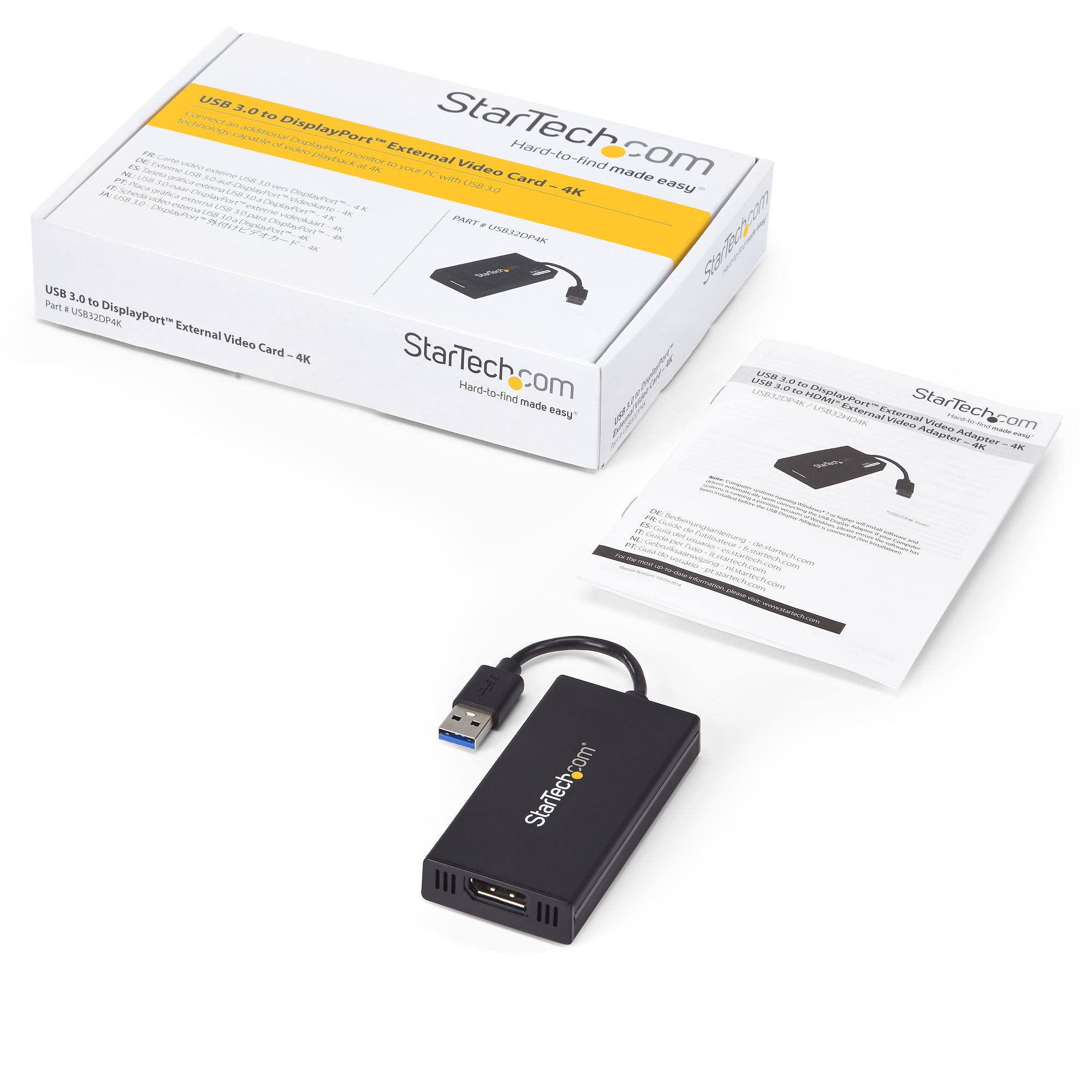 Una caja con adaptador StarTech, cable USB y manual sobre una superficie blanca.