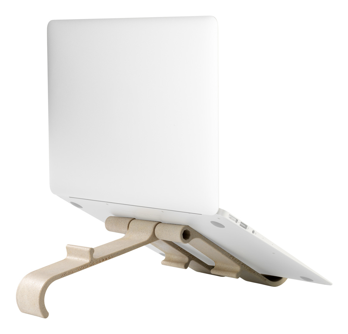 A white laptop is propped up on a beige laptop stand. The stand is made of curved, molded plastic with the brand name on it.