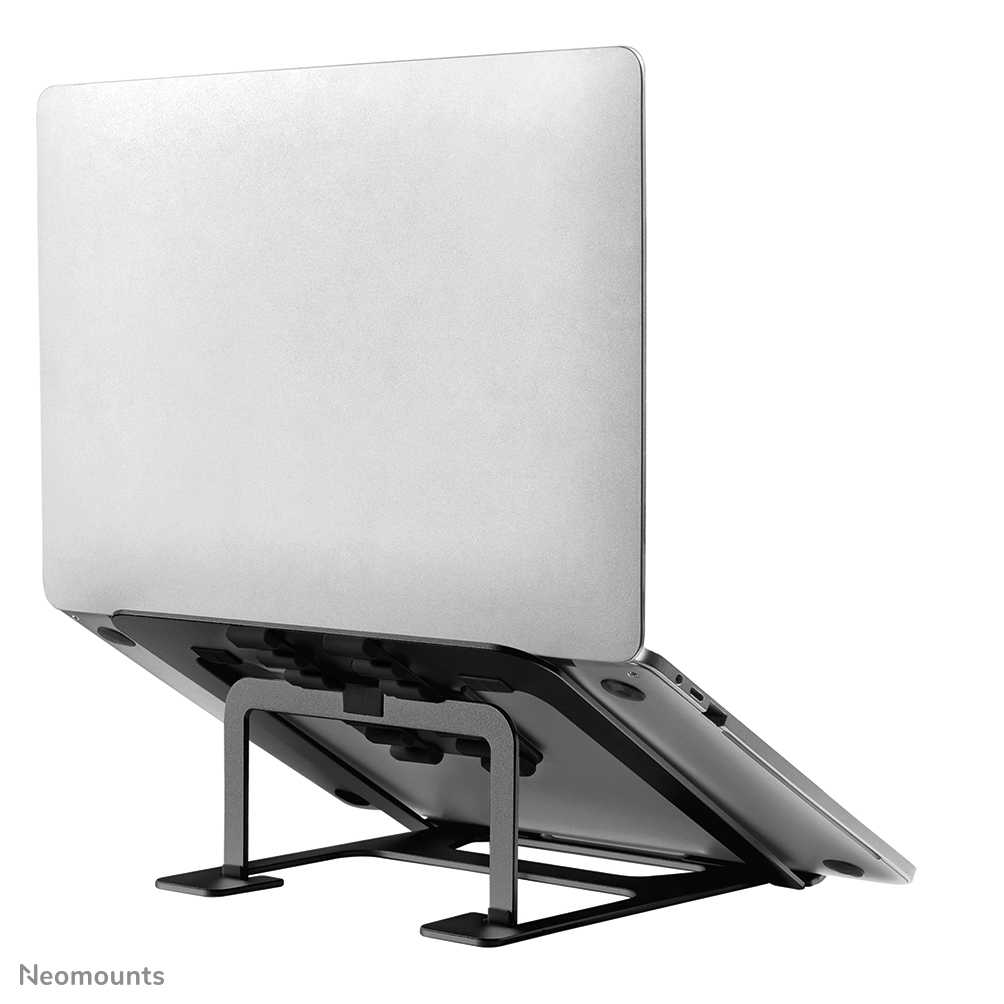 A silver laptop is on a black laptop stand. The laptop is angled back. The stand has a base and supports.