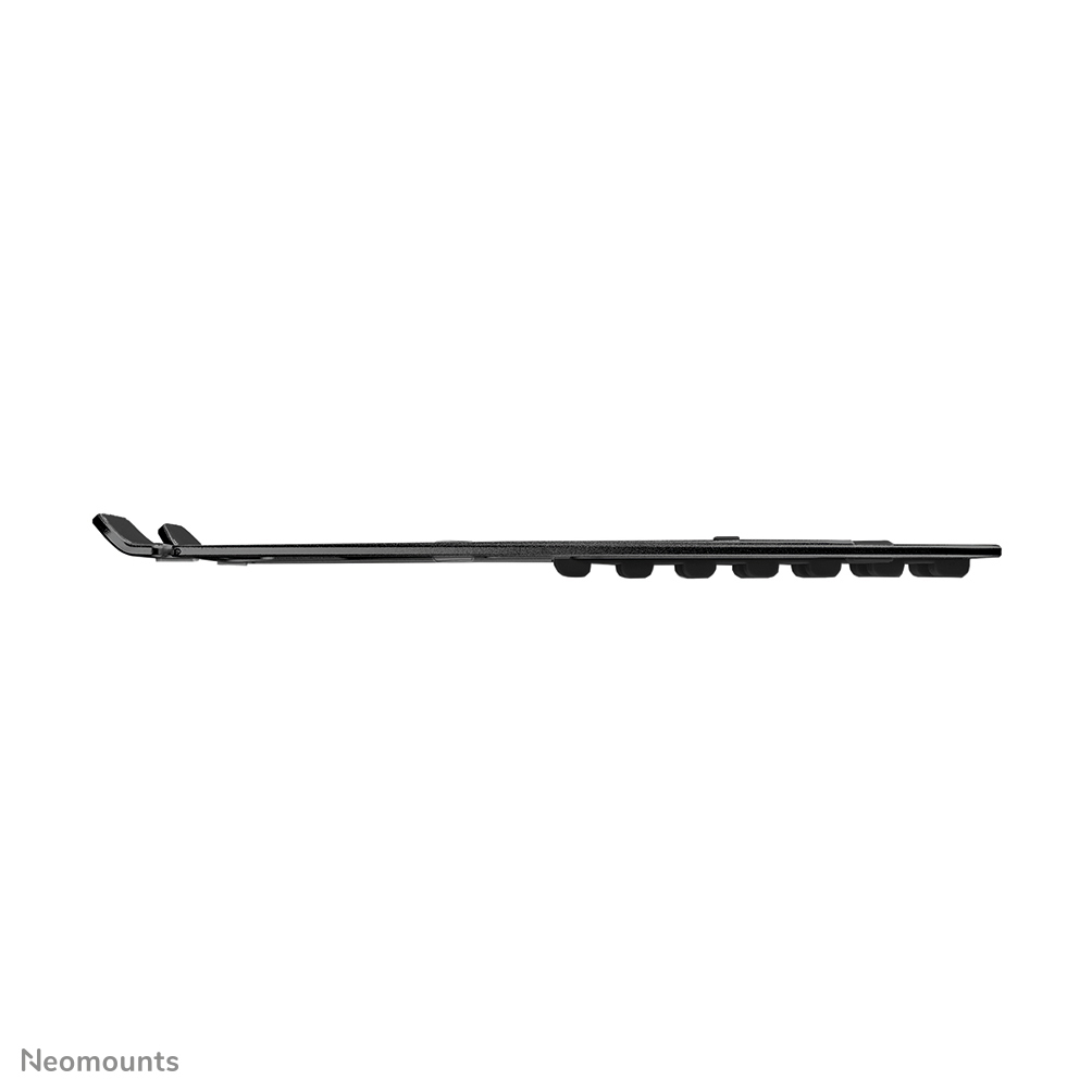 A side view of a black, elongated object. It has a series of rounded protrusions along its length and curved ends.