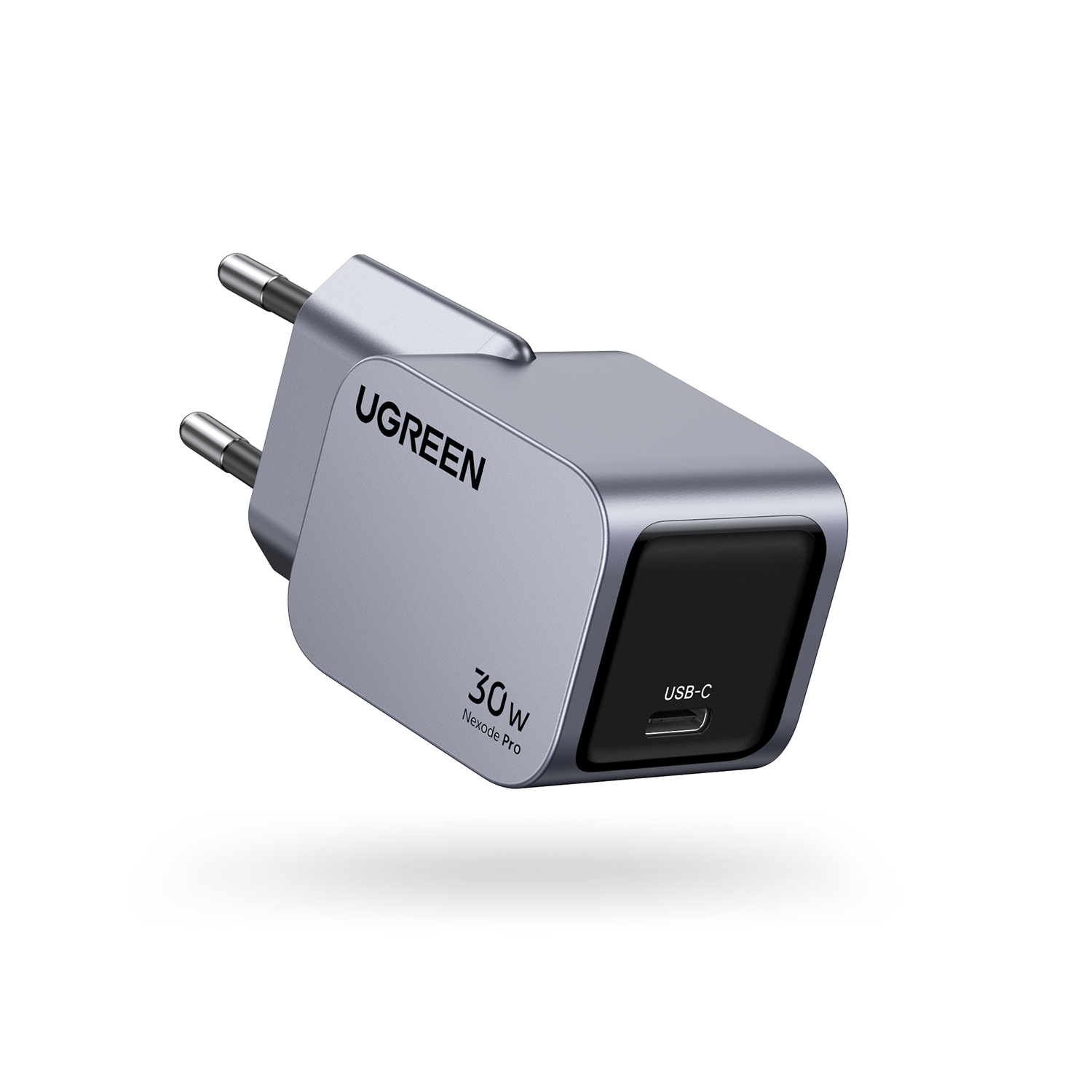 Ładowarka USB-C UGREEN 30W Nexode Pro. Jest szara i czarna z wtyczką. Ładowarka jest na białym tle.