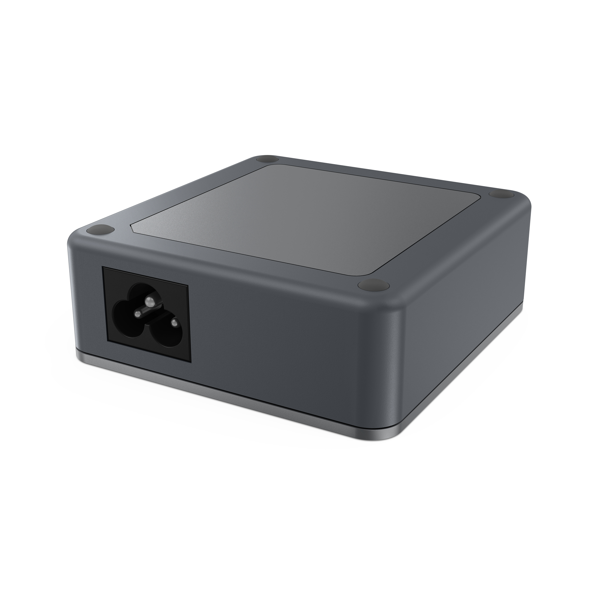 Un adaptador de corriente gris oscuro con un enchufe de tres clavijas en la parte delantera y una parte superior plana sobre blanco.