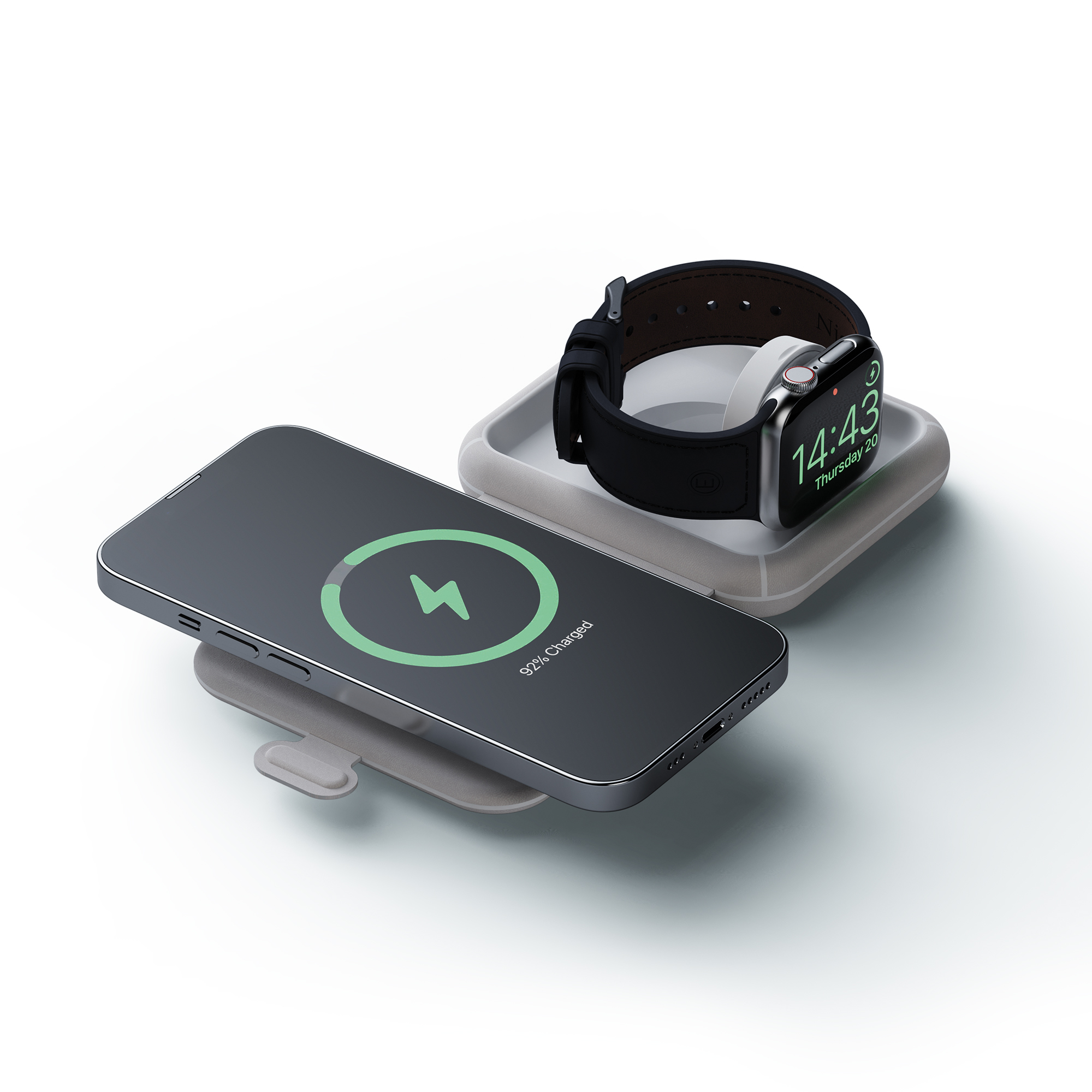 Ein Telefon, das kabellos geladen wird, mit einer Apple Watch auf einem Ladepad. Beide Geräte sind schwarz und grau.