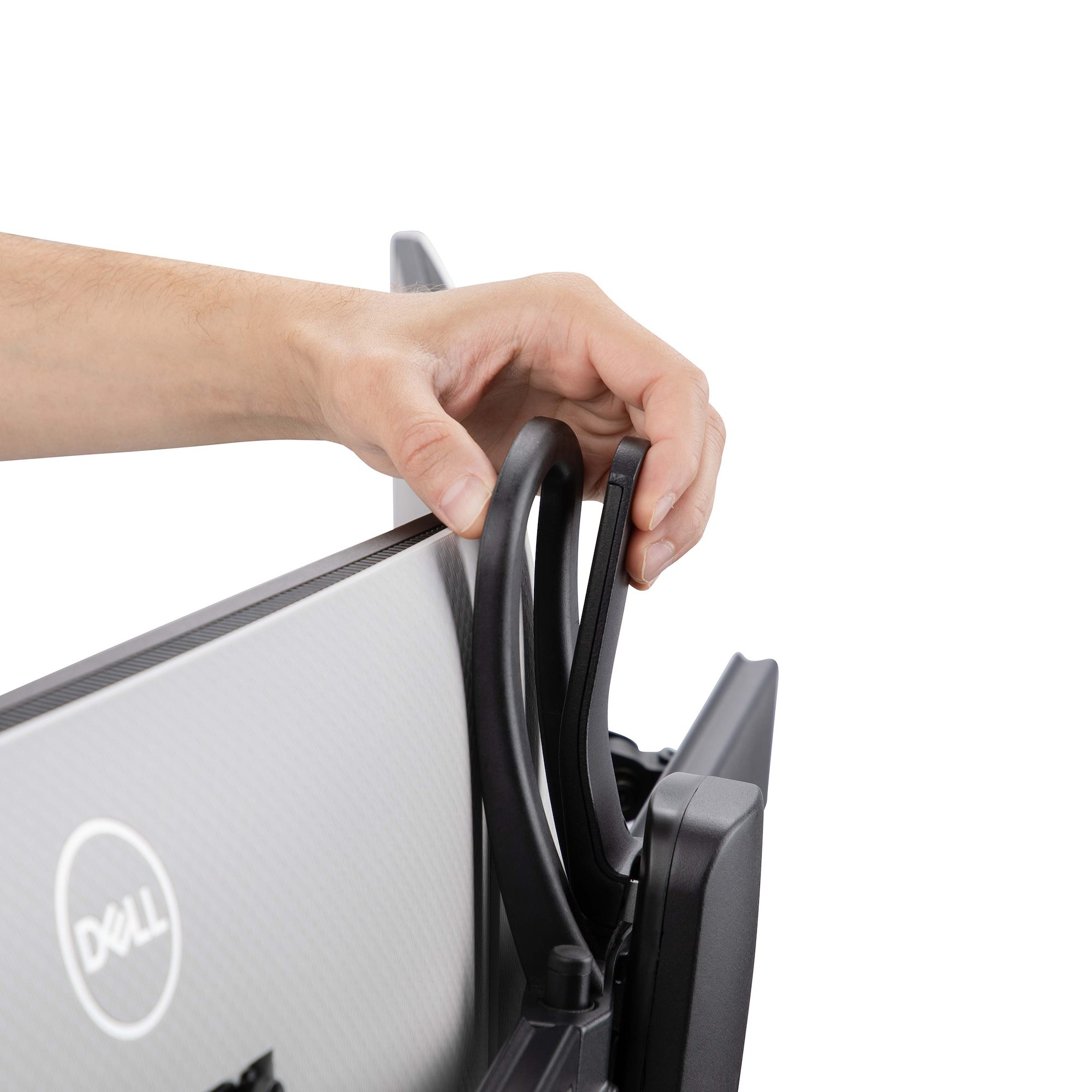Hand, die einen schwarzen Monitorarm einstellt, hält den gebogenen Griff. Ein Dell-Monitor ist teilweise sichtbar.
