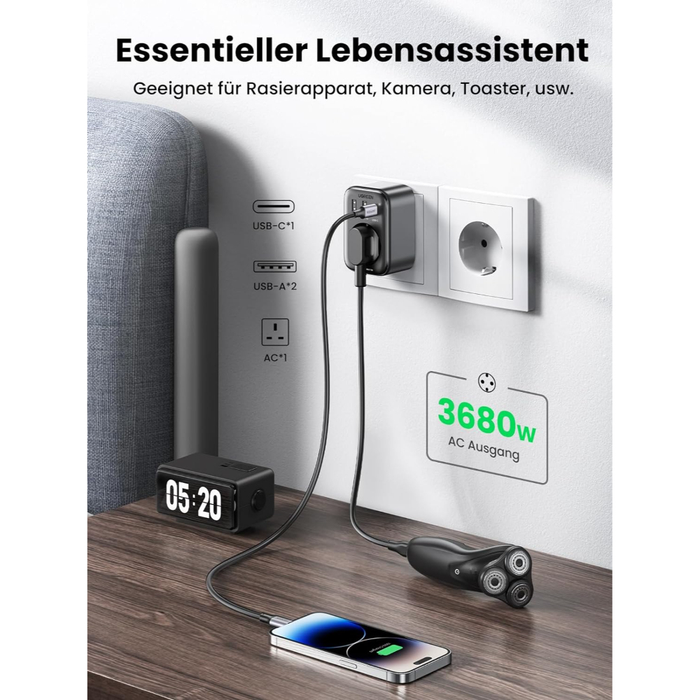 Zasilacz podłączony do gniazdka ściennego, ładujący telefon i golarkę. Zegar jest na stole.