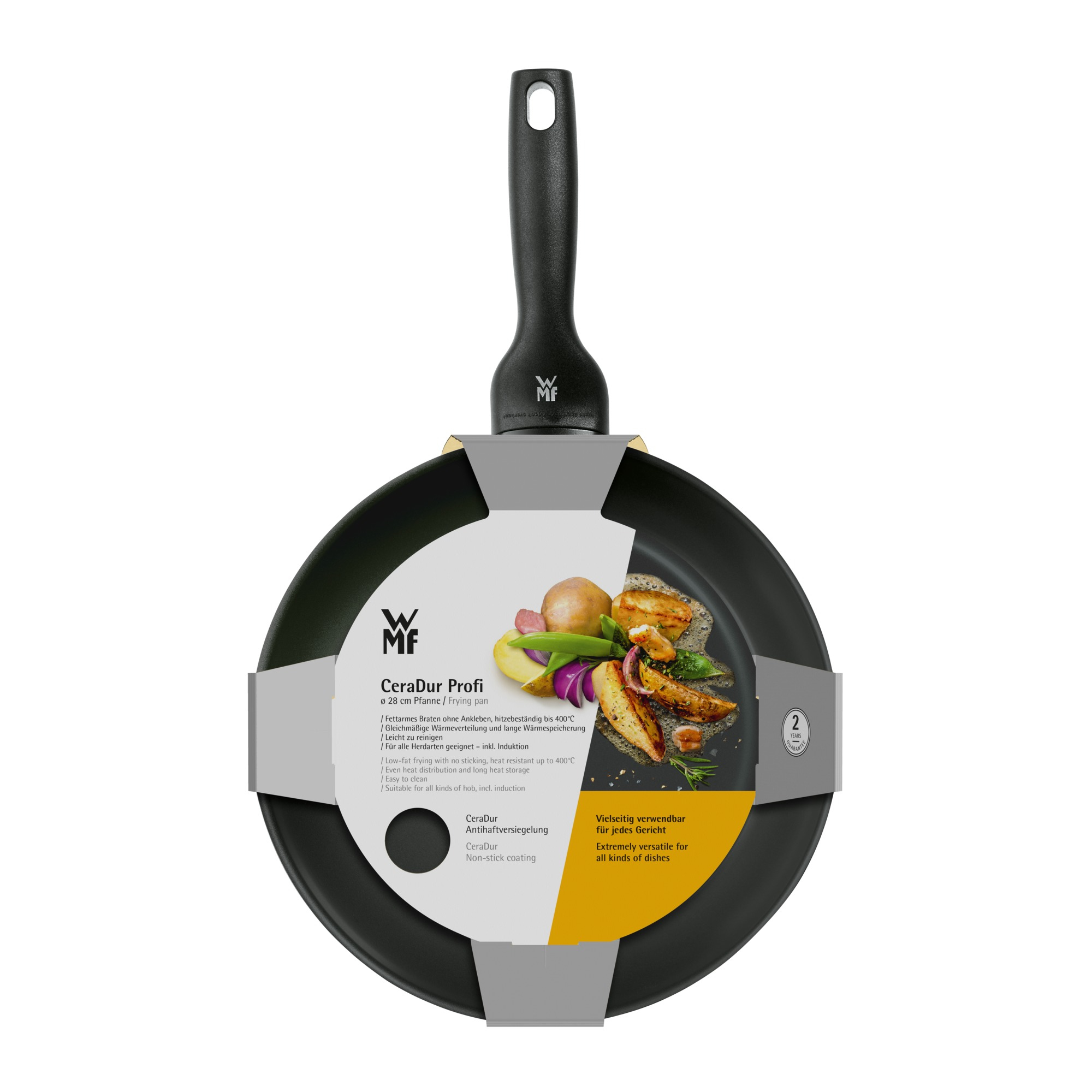 Schwarze Bratpfanne mit Essen darin. Textetiketten sind an der Seite. Kartoffeln, Zwiebeln und anderes Gemüse sind zu sehen.