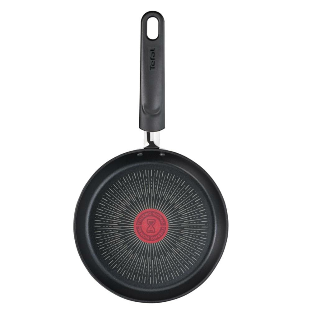 Eine schwarze Tefal-Bratpfanne mit langem Griff. Die Pfanne hat in der Mitte ein rotes Thermo-Signal, umgeben von konzentrischen Kreisen.