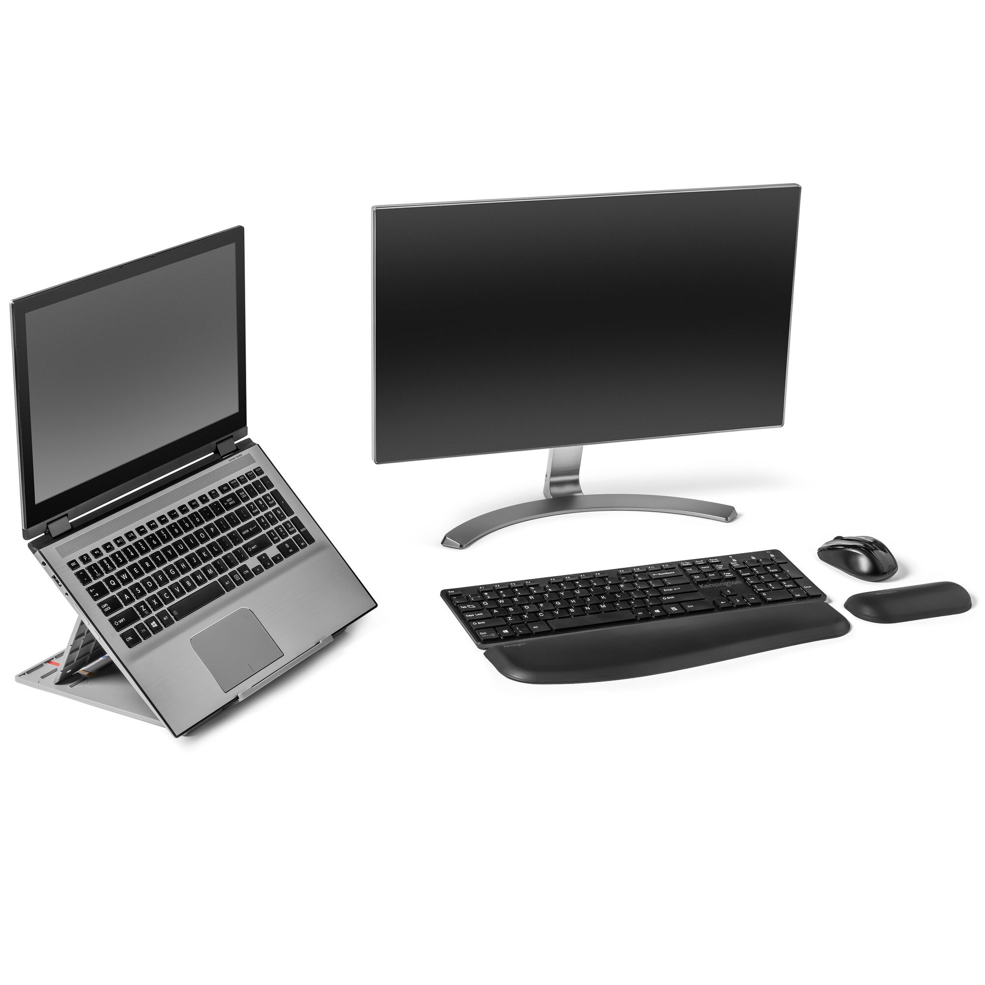 A laptop on a stand, a monitor, a keyboard with a wrist rest, a mouse, and a mousepad are on a white surface.