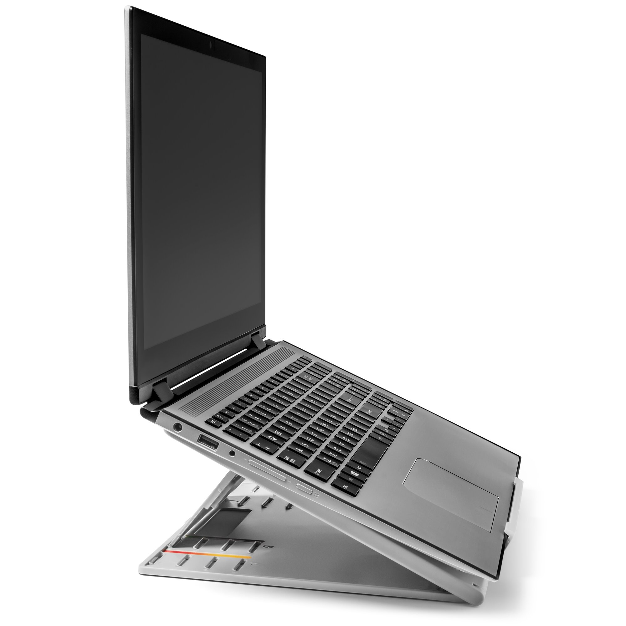 A laptop on a stand, angled upward. The screen is black. The stand is grey and has a keyboard.