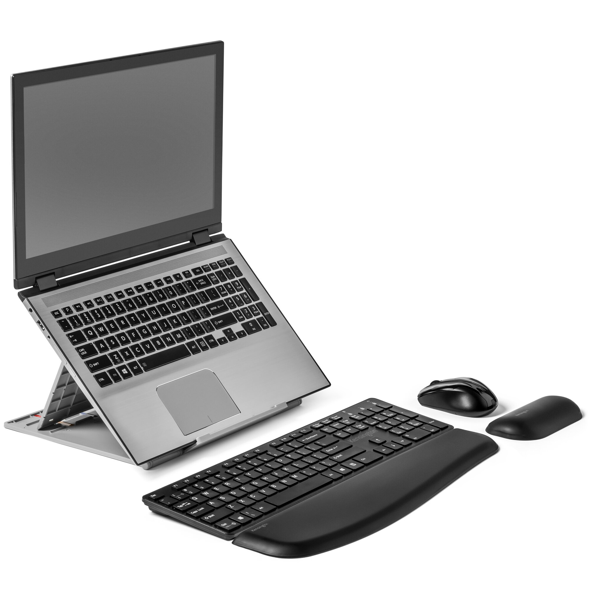 Laptop on a stand, keyboard with wrist rest, mouse, and a mousepad are on a white surface.