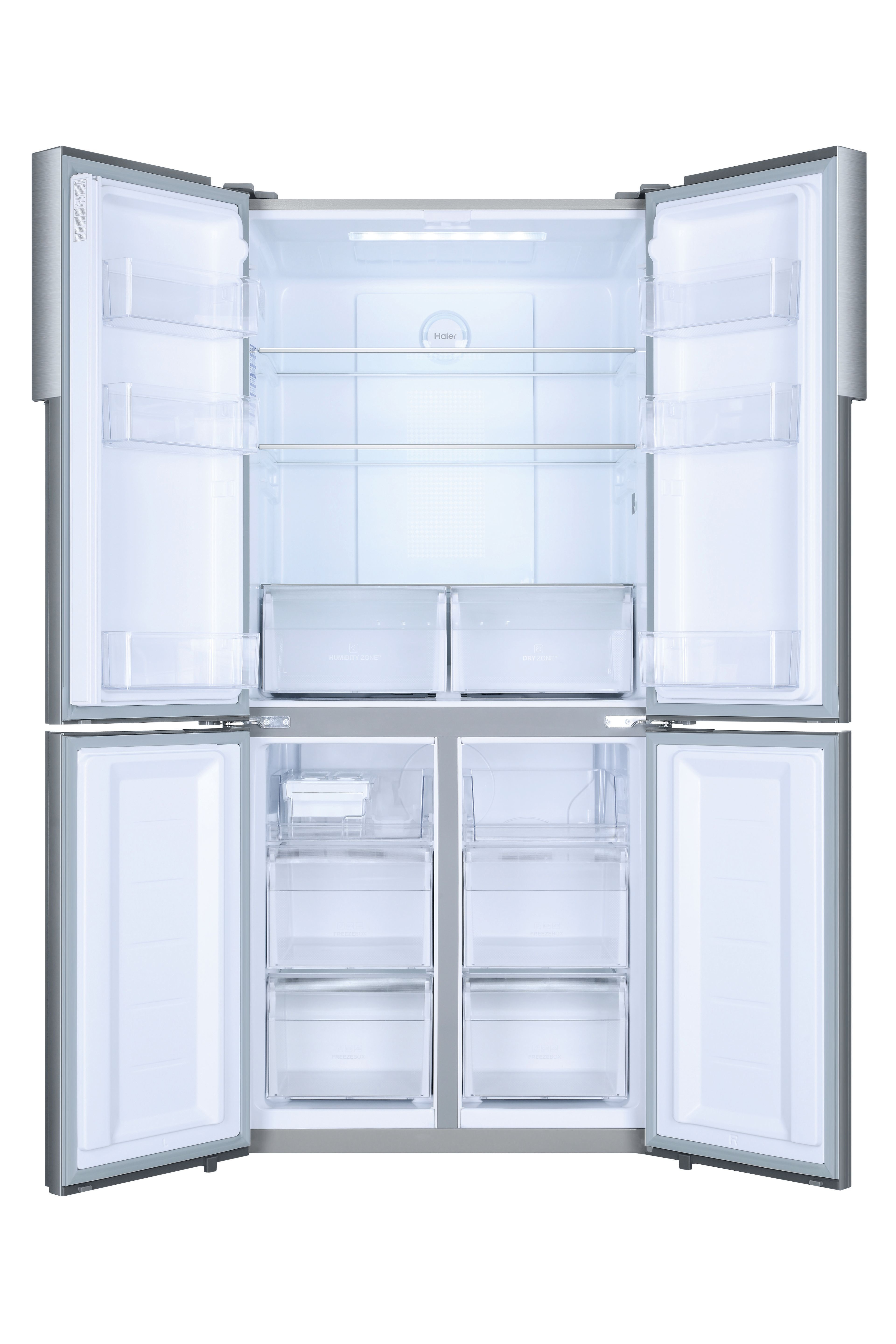 Refrigerador abierto mostrando estantes y cajones. Exterior gris, interior blanco. Logotipo Haier visible. Vacío.