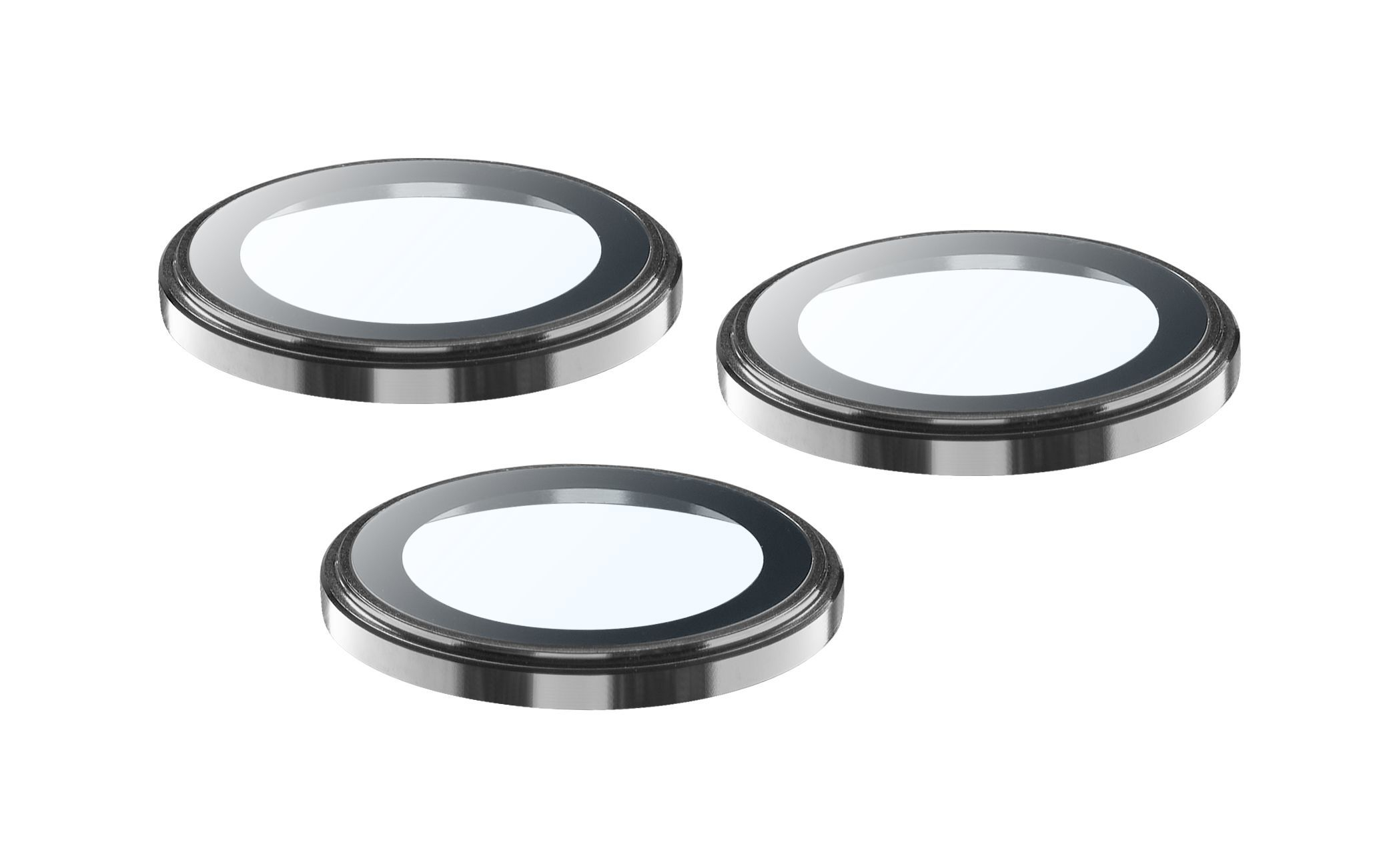 Tres filtros circulares de lentes de cámara. Cada uno tiene un marco plateado, un anillo oscuro y un centro transparente, sobre fondo blanco.