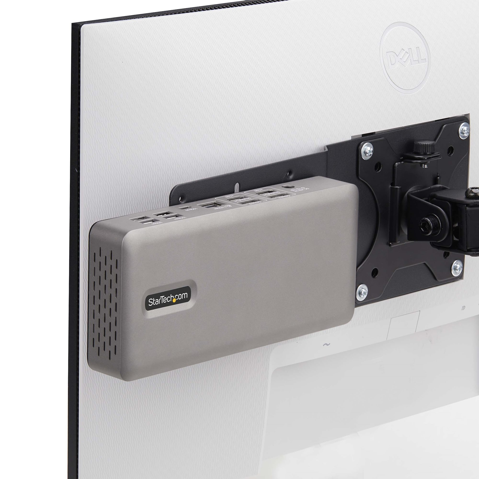 Ein grauer StarTech.com-Dockingstation ist an der Rückseite eines Dell-Monitors montiert.