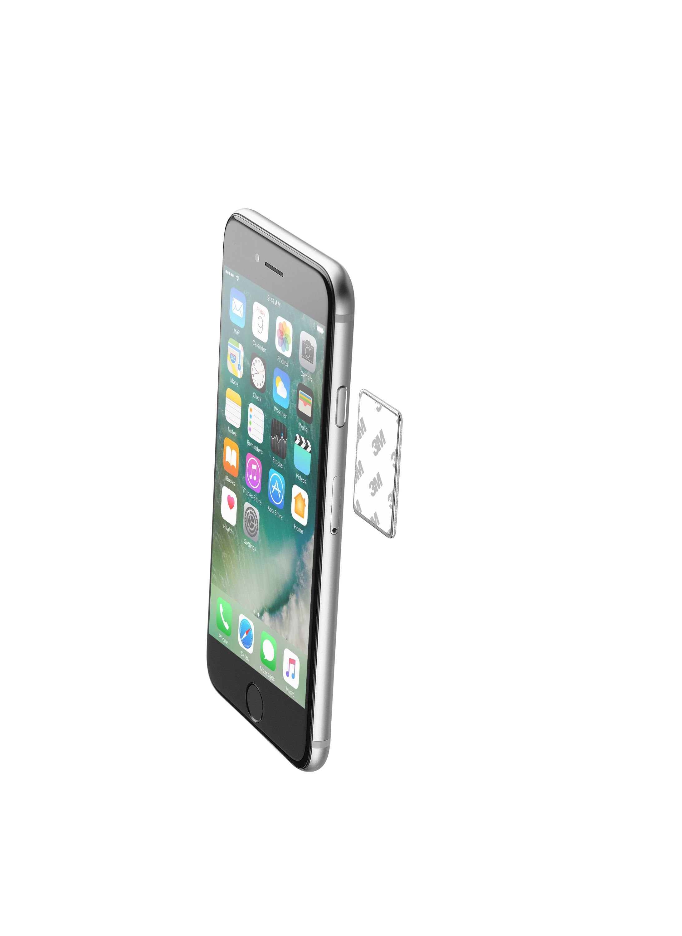iPhone plateado con iconos de aplicaciones. Almohadilla adhesiva adherida al lado del teléfono.