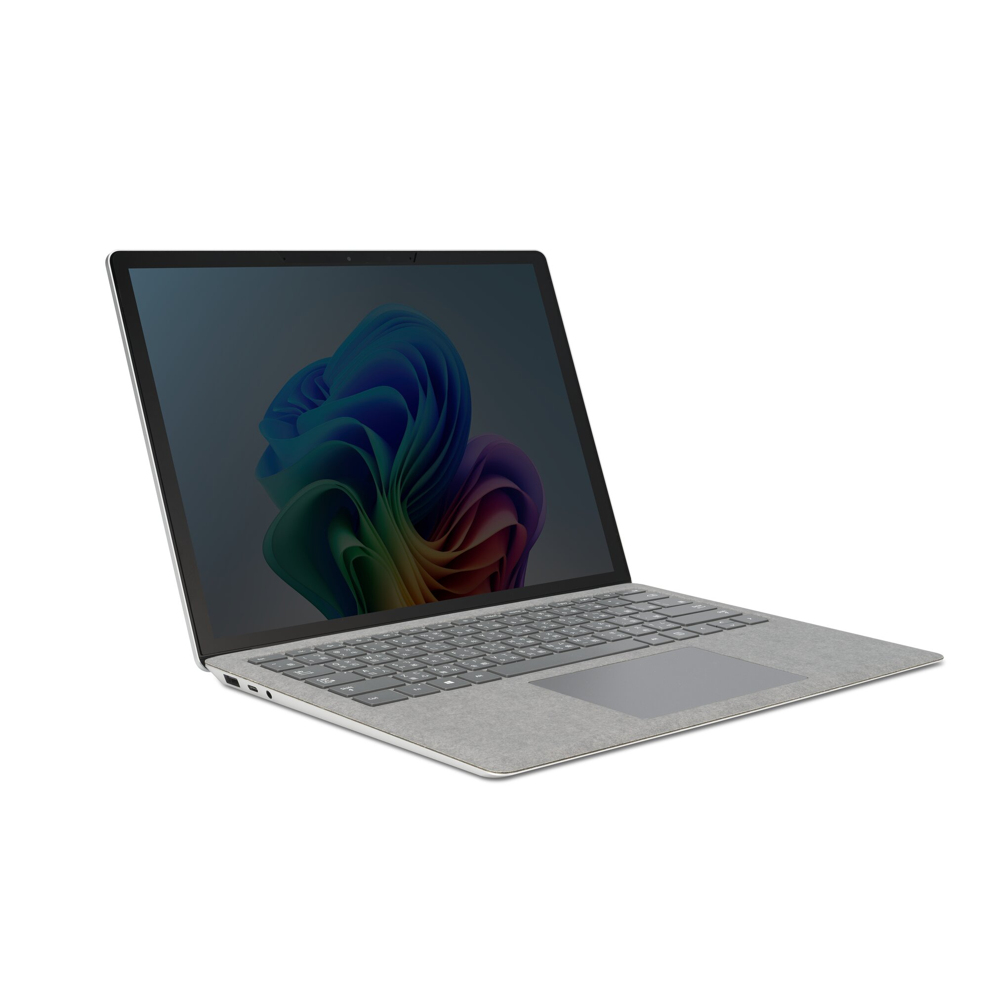 Un laptop grigio è angolato, mostrando tastiera e schermo. Lo schermo mostra un vortice astratto colorato su sfondo scuro.