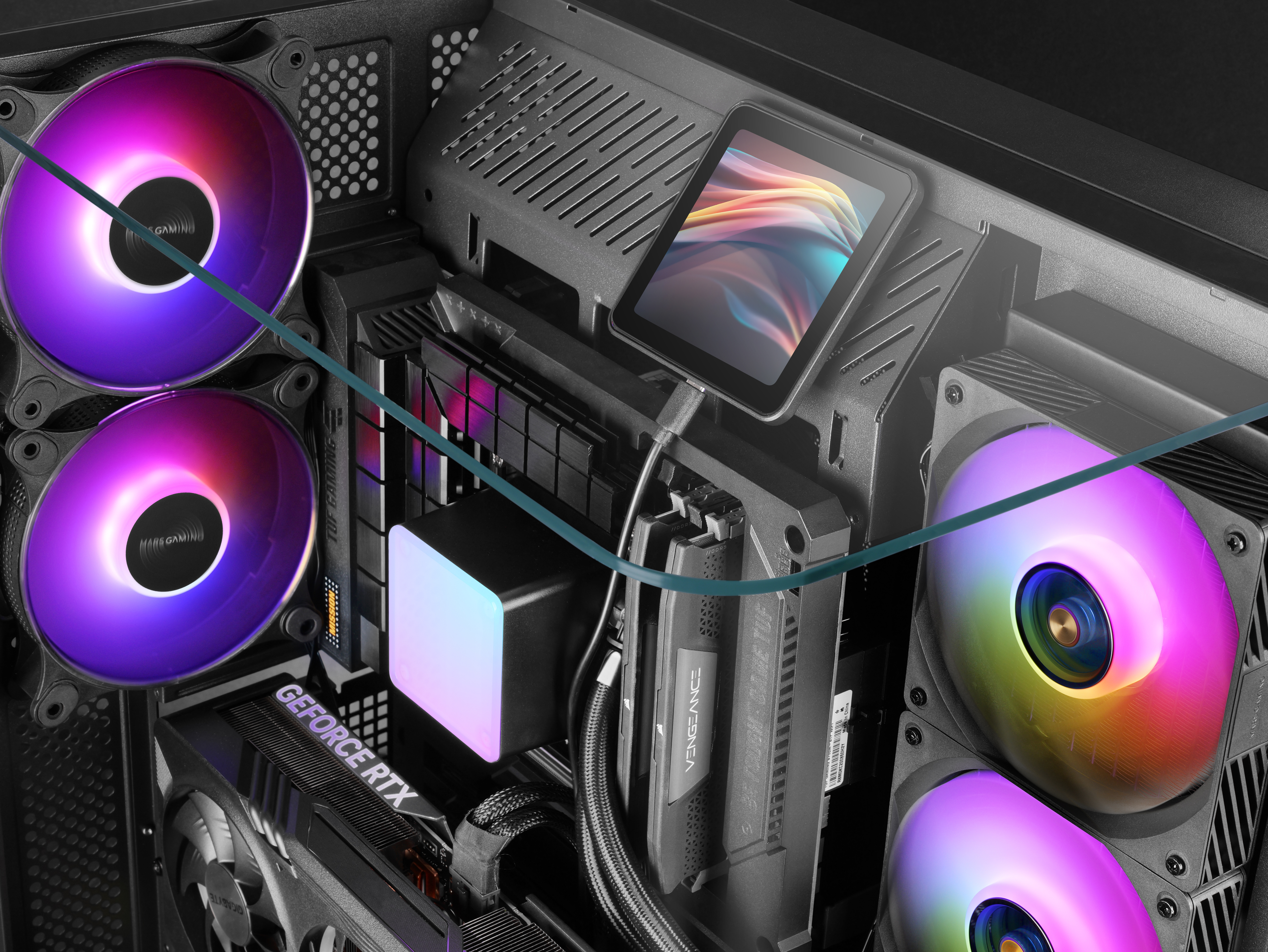 All'interno di un case di computer, ventole con illuminazione RGB, un tablet e vari componenti.