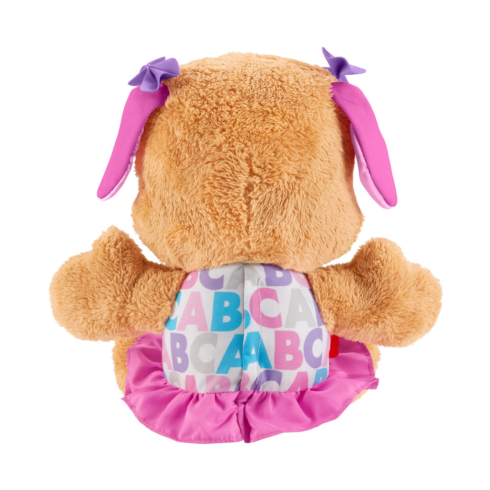 Se muestra un perro de peluche desde atrás. Tiene pelaje marrón, orejas y falda rosas y lazos morados. El vestido tiene letras ABC.
